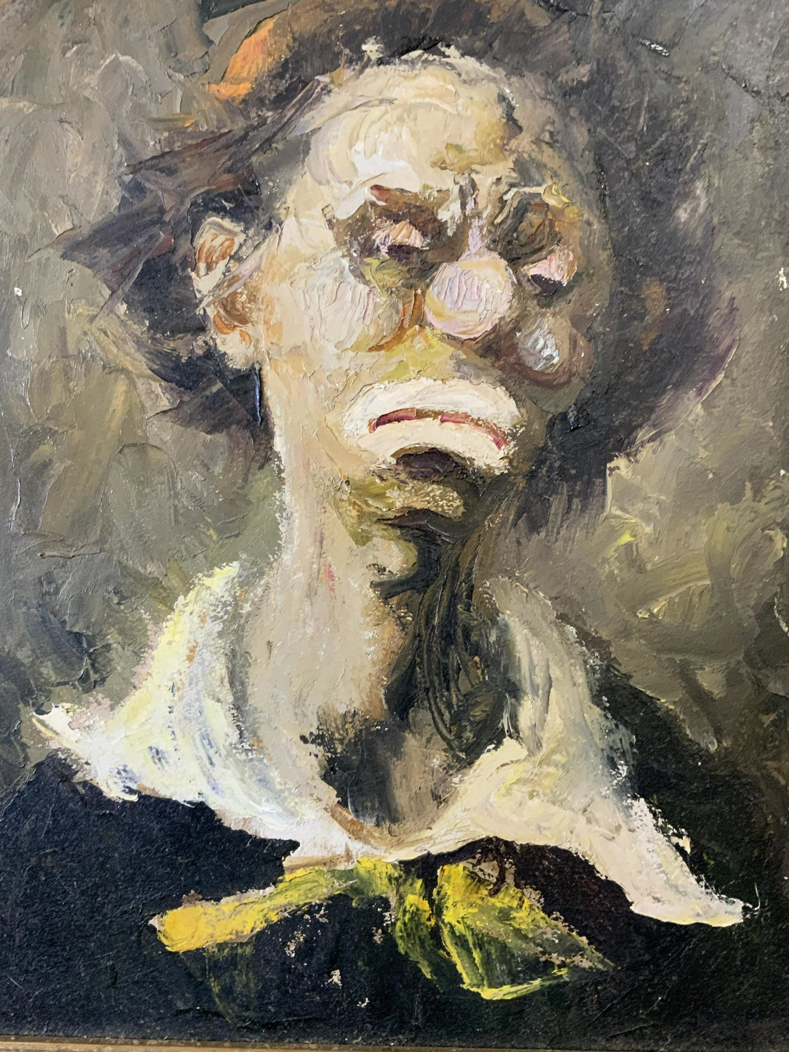 Oil on Board Painting of a Clown: Oil on board painting of a clown, no apparent inscriptions or markings, subject a foreign clown, dark muted color palette, thick impasto brushstrokes, gilt wood frame, measures 23 inches tall by 21 in