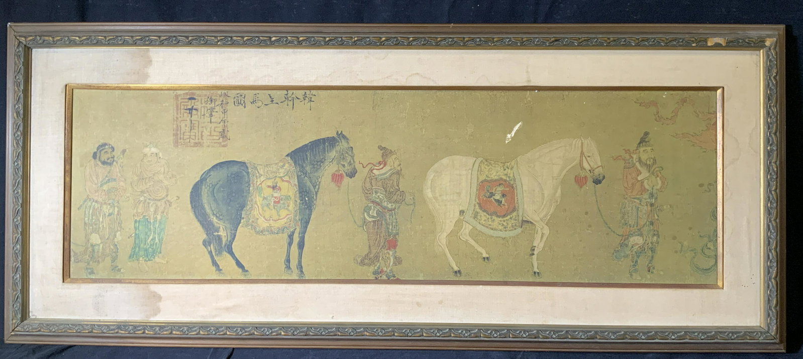 HAN KAN Horse Tribute Lithograph: HAN KAN Horse Tribute Lithograph, inscriptions to piece in Chinese characters, subject figures leading horses, measures 19 7/8 x 47 1/2 inches, wooden frame, surface wear and losses to frame and piece