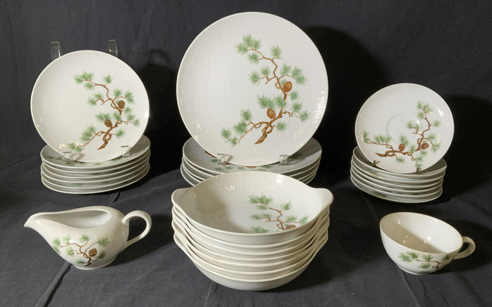 Set 29 OMEGA JAPAN Porcelain Dinnerware: Set 29 OMEGA JAPAN Porcelain Dinnerware, stamp reads ‘Omega China Japan Rainier Pine’, teacup measures 2 inches tall x 4 inches in diameter, saucers measure 6 1/8 inches in diameter, largest plate