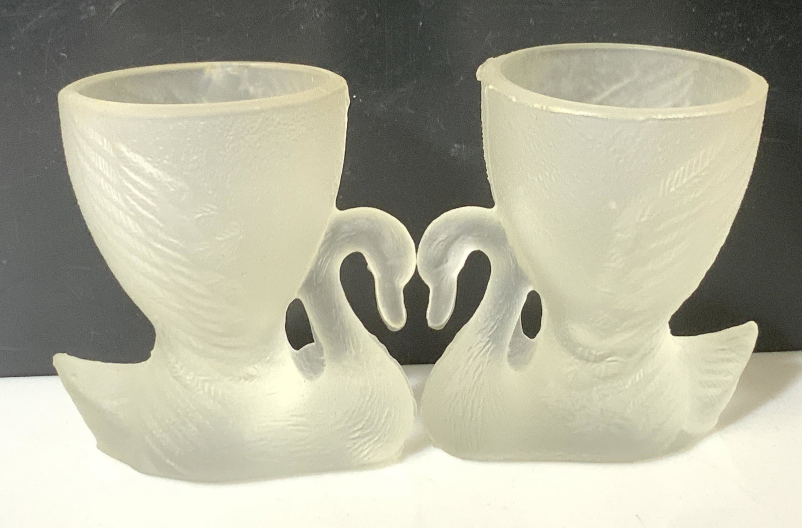 Vintage Glass Swan Boiled Egg Holders, 4: Shaded glass and etched glass, figural of swan hold up a vessel that holds a hard boiled egg. Molded glass. Vintage, chop to 1 rim. 2.25 in ht. And length. Kitch, swan Kitch, hard boiled egg vessel, K