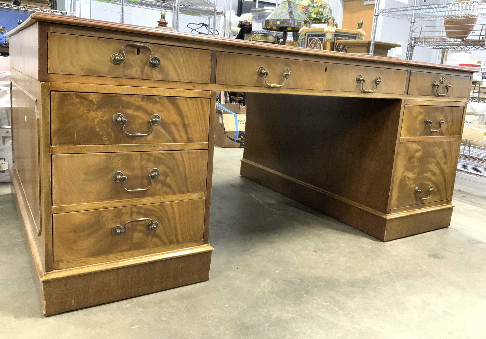 Antique English Wooden Partners Desk: Desk has bottom lower area open to allow for 2 chairs to sit facing each other. Desk is antique. Piece has separate top which sits on drawer areas. In total, desk has 8 drawers. Each drawer has hand d