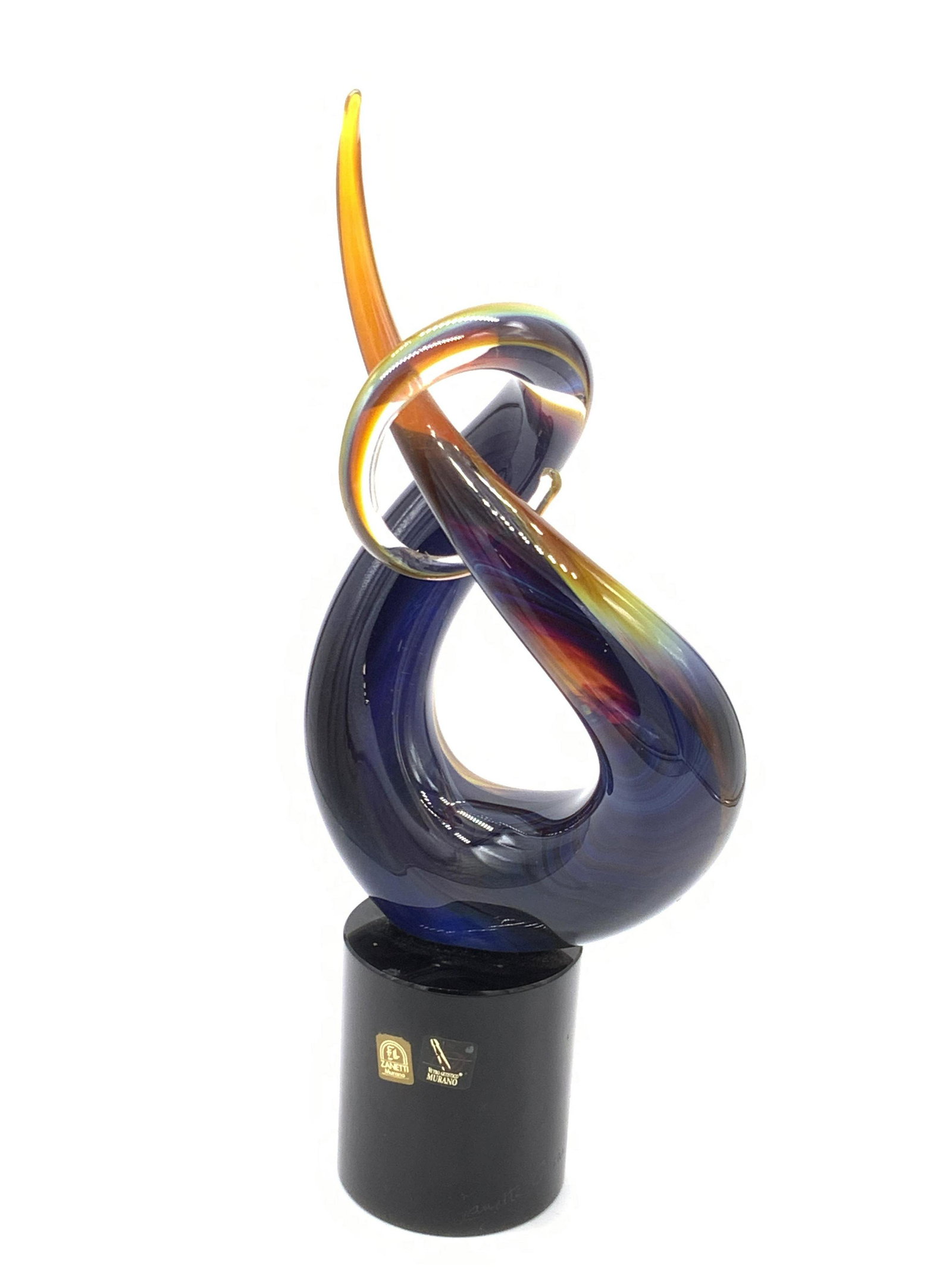 Signed ZANETTI MURANO Italian Art Glass Love Knot: Sculpture made of chalcedony glass, using the massello technique. Sculpture has shifting hues of blue, white, green, and more. Crafted and signed by ZANETTI OSCAR. Stickers read ZANETTI MURANO, VETRO 