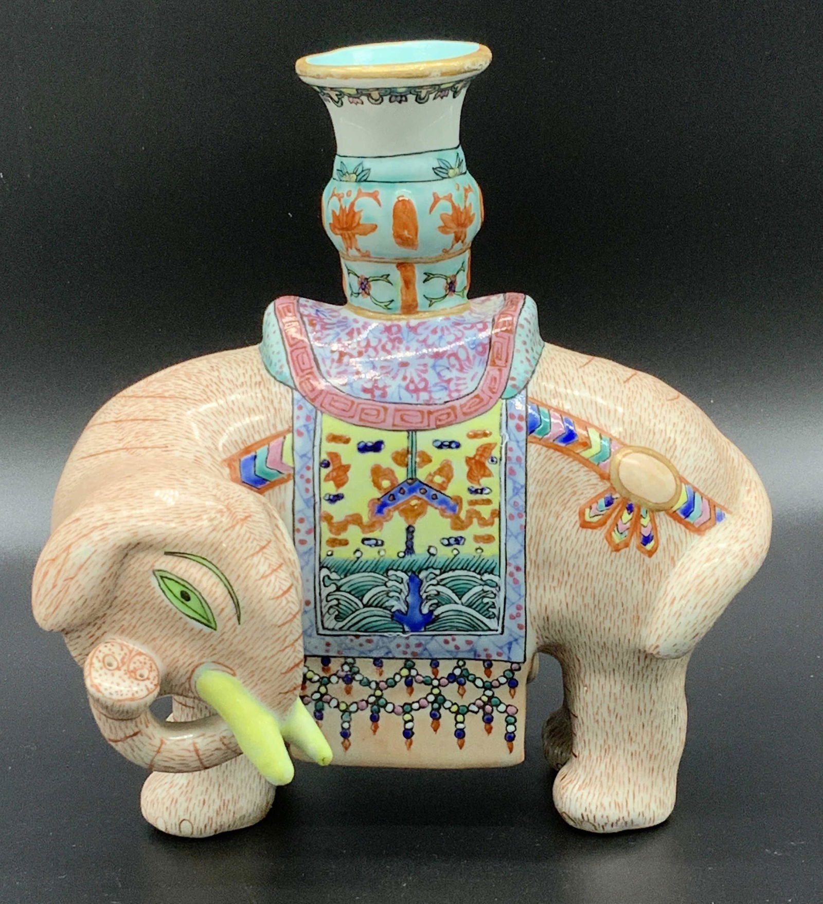Chinese Ceremonial Porcelain Elephant Candle: Holder. Beautiful hand painted piece, possibly antique, no marks, detailed patterns on animal and on ceremonial rug, thunder and cloud , Taotie Design. Bright and colorful and not only ornamental but
