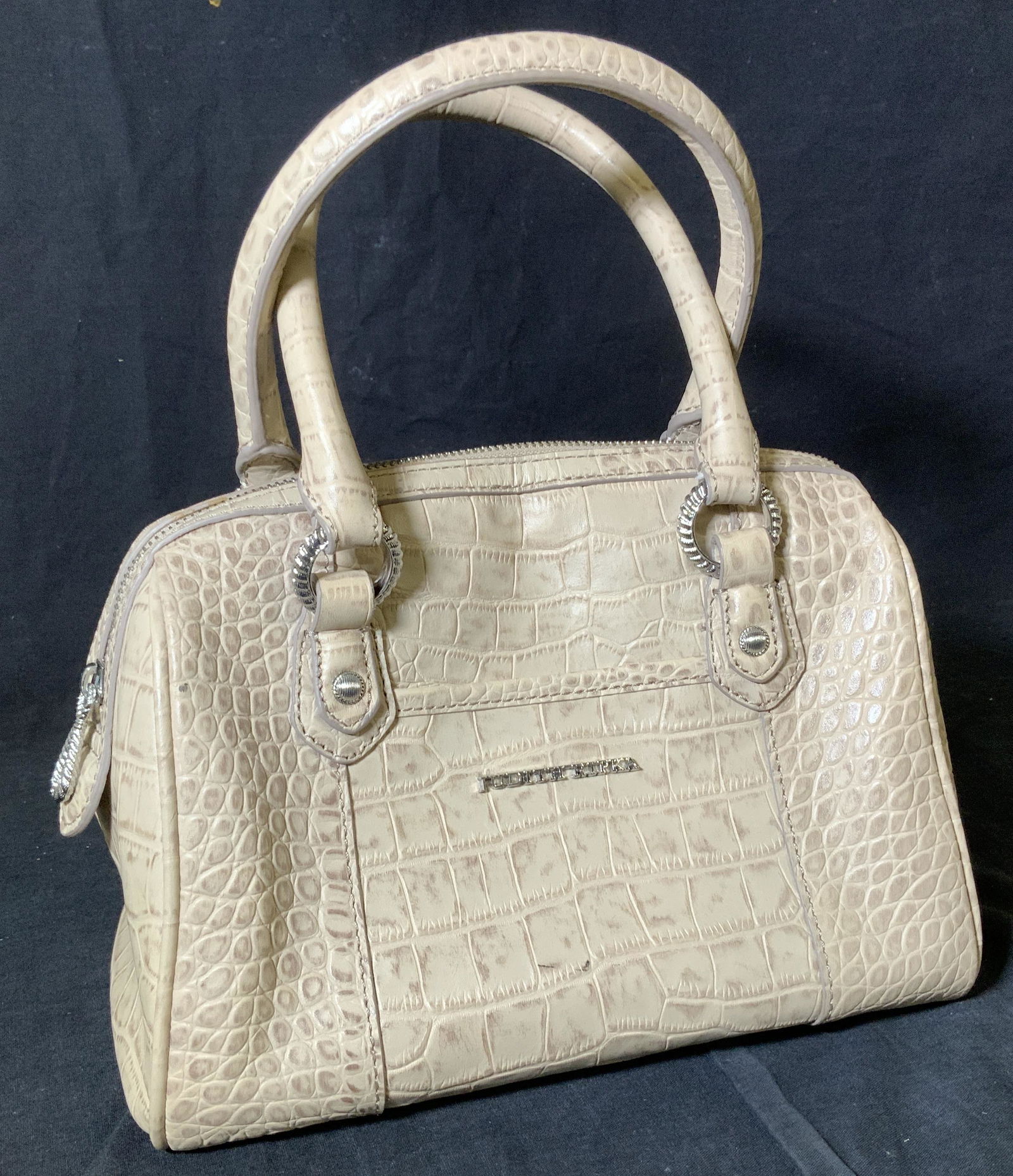 JUDITH RIPKA REPTILE LEATHER HANDBAG: Everyday pocketbook adorned with JUDITH RIPKA styled accessories Ed hardware, in her style of jewelry. embossed in a polished silvertone juxaposed to a tanned leather. Hallmarked with designer name on