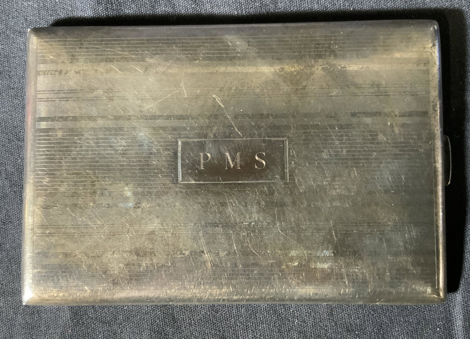 WATSON Sterling Silver Cigarette Case: WATSON Sterling Silver Cigarette Case, mark features a crown, W, and lion, inscription reads ‘Sterling 2670 RC’, monogrammed initials read ‘PMS’, measures 4 5/8 x 3 1/8 inches, weight: 5,22 oz