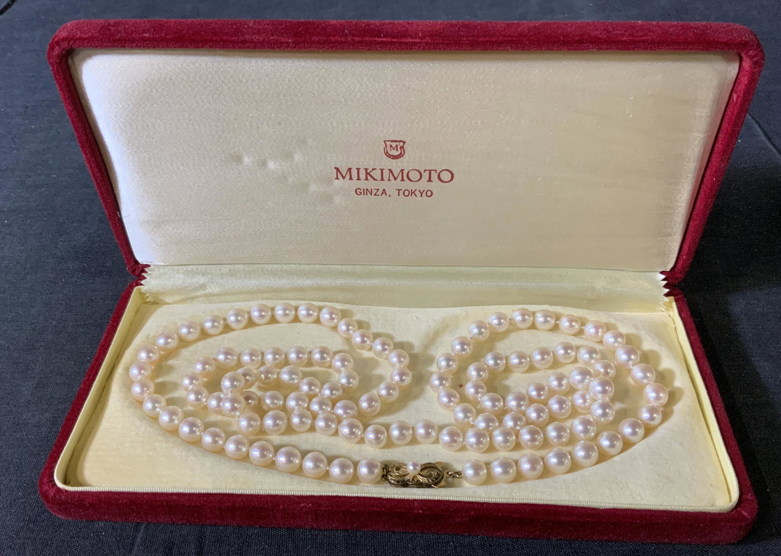 MIKIMOTO Akoya Pearl Necklace: MIKIMOTO Akoya Pearl Necklace with 14kt gold clasp, inscriptions to piece and original box read Â‘MIKIMOTO Ginza, Tokyo Made in JapanÂ’, Â‘M K14Â’, 36 in from end to end. pearls measure 1/