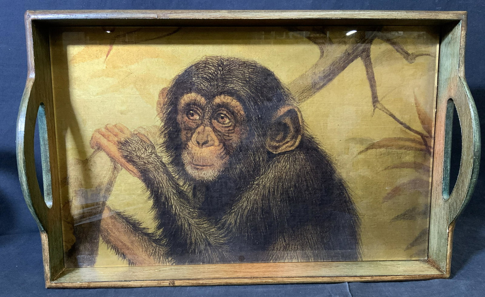 Wood & Glass Monkey Motif Tray: Wood and glass monkey motif tray, no apparent inscriptions or markings, subject a wooden tray with a glass piece to the interior, glass interior has a pictorial scene of a monkey holding on to a tree 