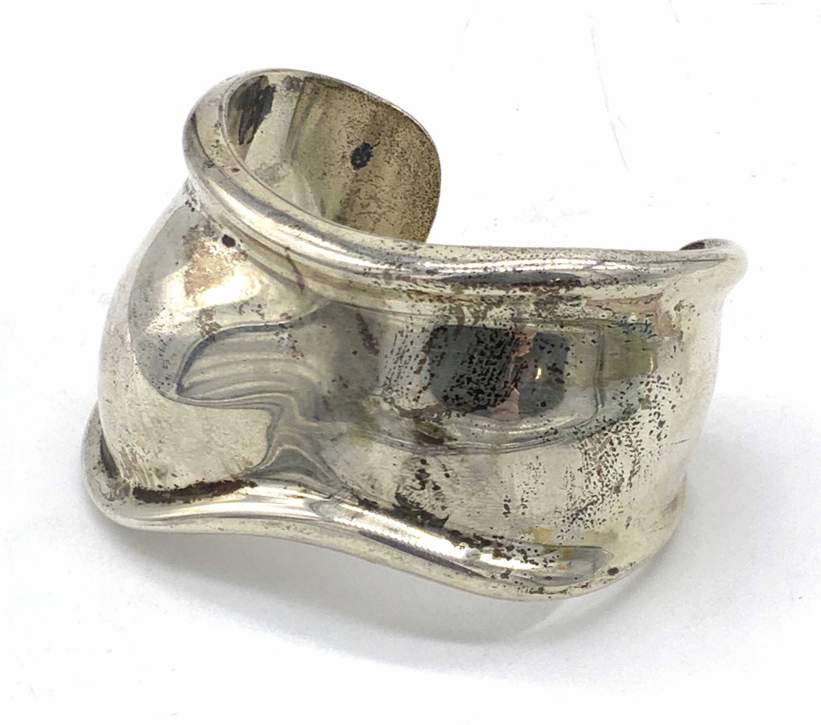 Vntg TIFFANY & CO. Sterling Silver Bone Cuff, Bag: Vintage, 1978, Tiffany & Co. sterling silver small bone cuff bracelet designed by Elsa Peretti. The piece is contained in a Tiffany & Co. dust bag. Interior reads TIFFANY & CO, SPAIN STERLING, 1978. P