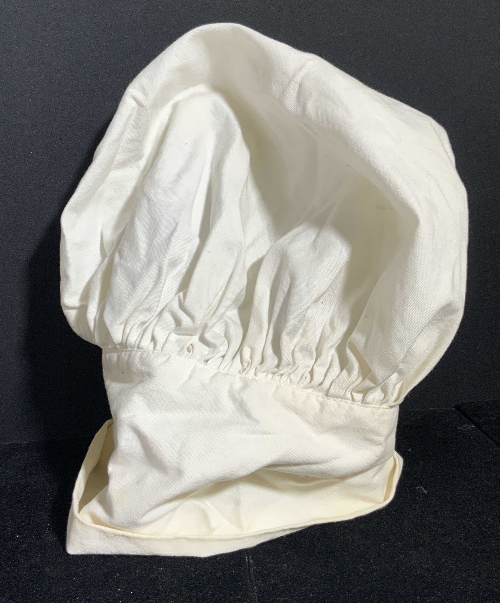 ORIGINALS BY GWEN INC. Vintage Chef’s Hat: A vintage chef’s hat that was once used by the chef of the yacht, The Byronic. The Byronic was the private family yacht that belonged to Byron S. Miller, Woolworth CEO. Piece has some wear consisten