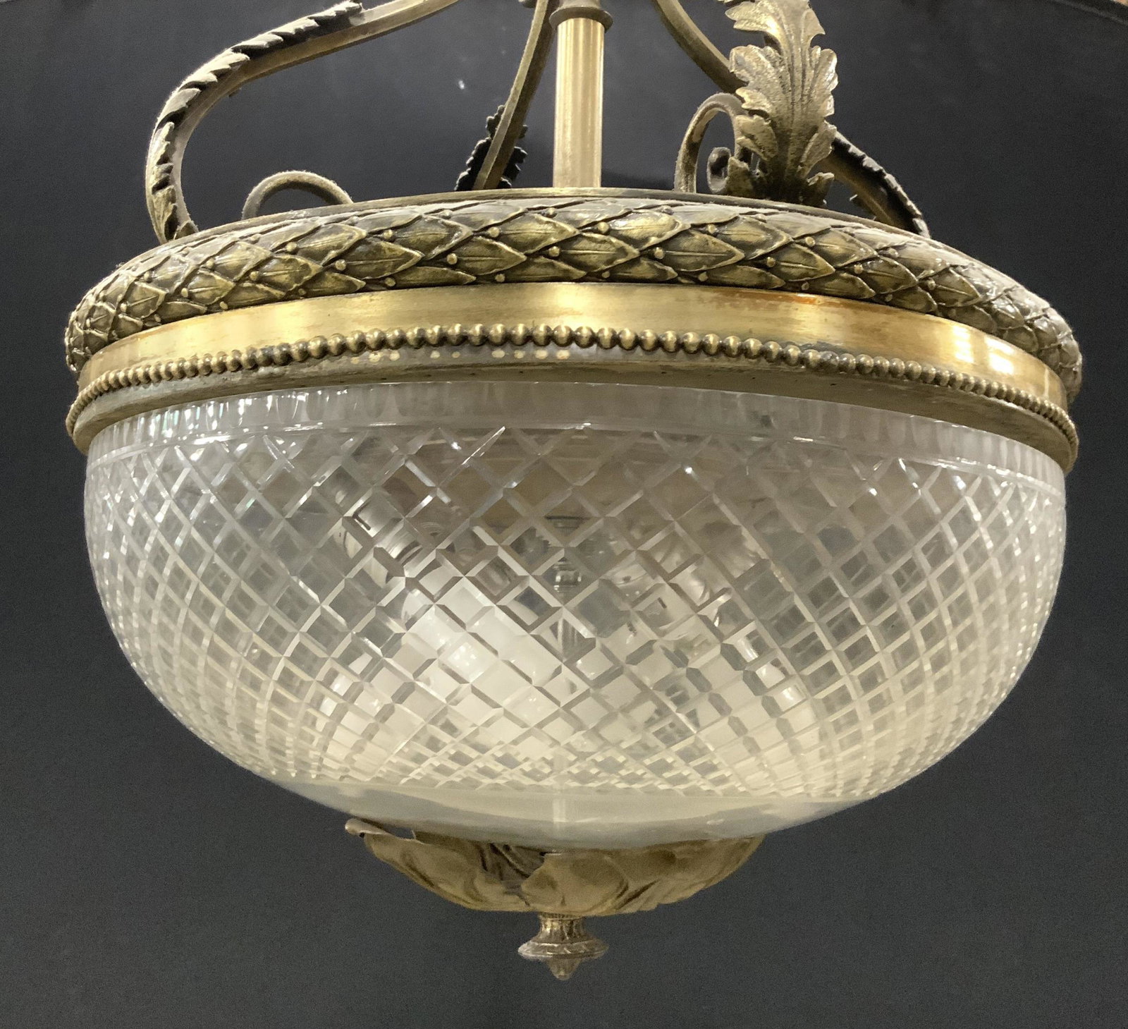 Vntg Ornate Chandelier W Bowl Shaped Crystal Shade: Chandelier is gold toned & brass. Piece has 4 S curve structures. Chandelier is vintage possibly antique. Shade Bowl shaped & appears to be crystal. Piece measures approx 26 inches tall 17 inches wide