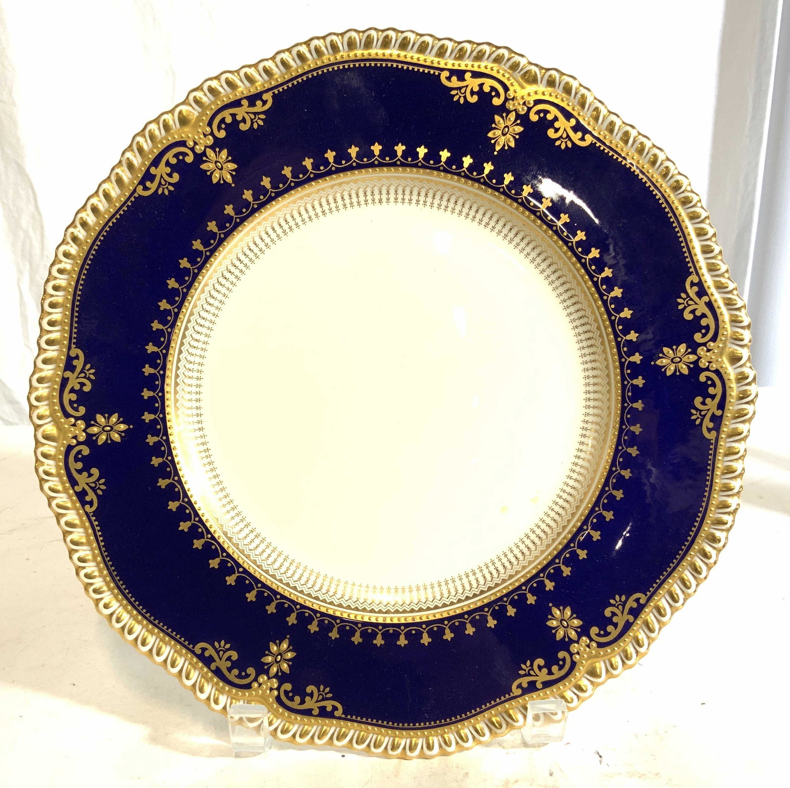 SPODE COPELAND ENGLAND Porcelain Plate: Underside of piece is marked SPODE COPELAND ENGLAND. Piece is cream & blue toned with gold toned ornate accent detail. Piece measures approx 10.5 inches wide. Porcelain plate, Spode porcelain, Spode C