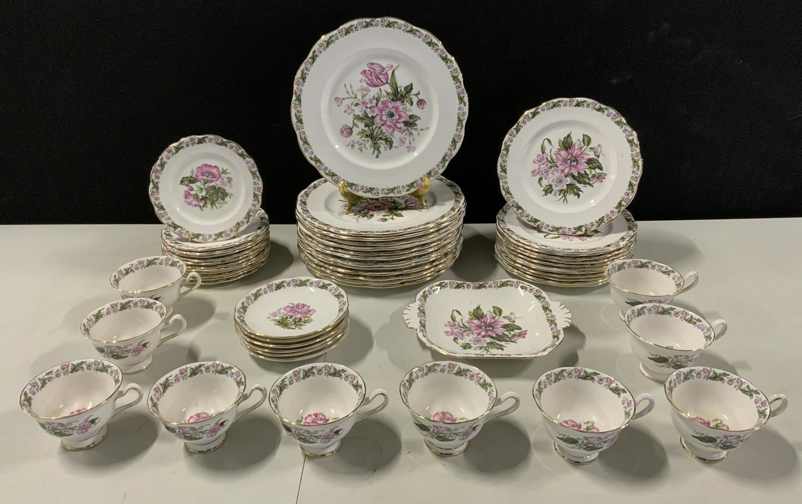 Set 53 ROYAL ALBERT Bone China Dinnerware: Set 53 ROYAL ALBERT Bone China Dinnerware, c 1935-45, stamps read ‘Royal Albert Bone China England Cotswold’, teacups measure 2 1/2 inches tall x 4 inches in diameter, saucers measure 6 5/8 inches