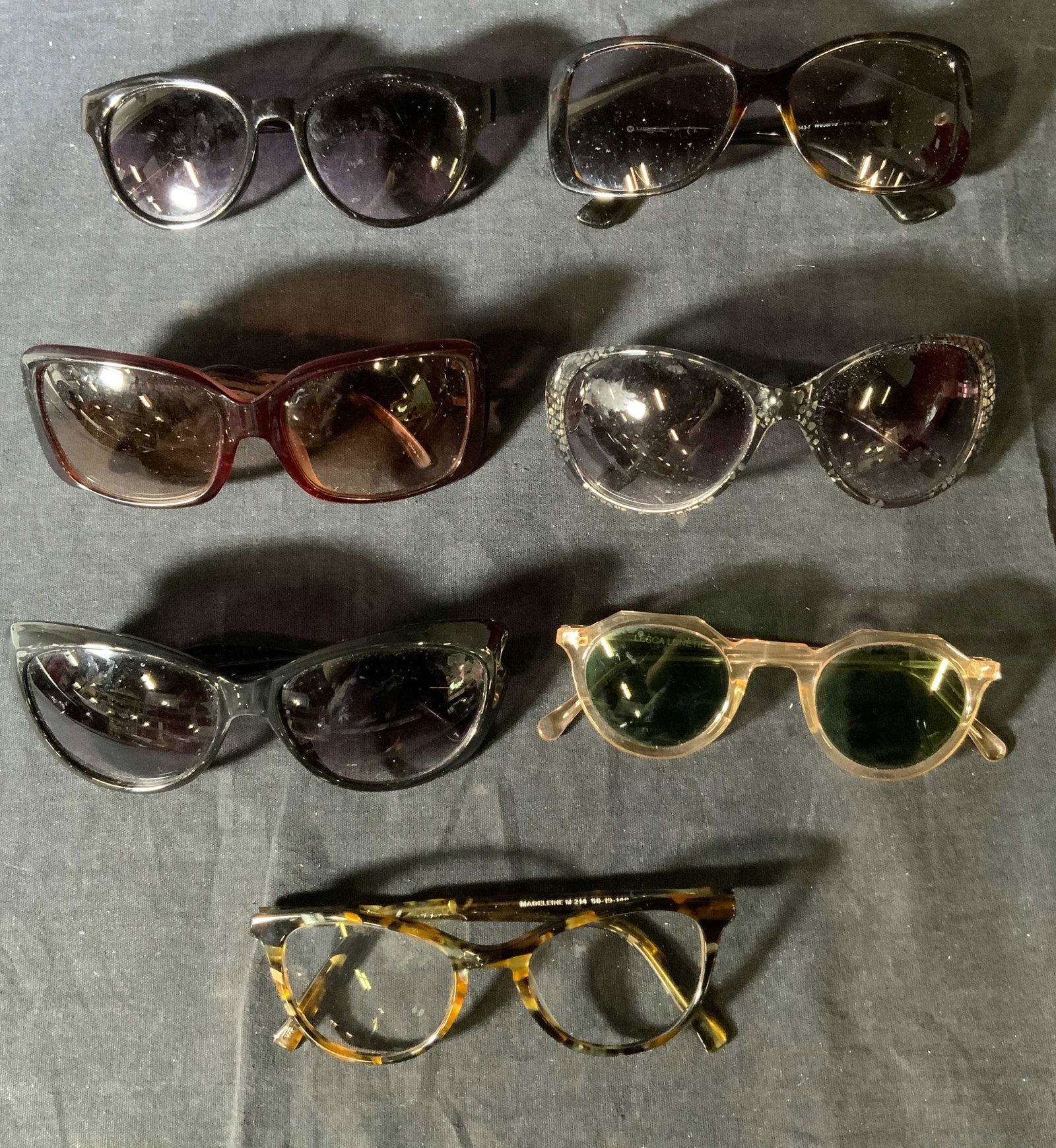 Lot 7 Women’s Sunglasses & Glasses: Lot 7 Women’s Sunglasses & Glasses, inscriptions read ‘Sofia Vergara’, ‘Dana Buchman’, ‘Warby Parker’, ‘LRI’, ‘Vogue’, ‘Marilyn Monroe’, ‘Lesca Lunetier’, surface wear to