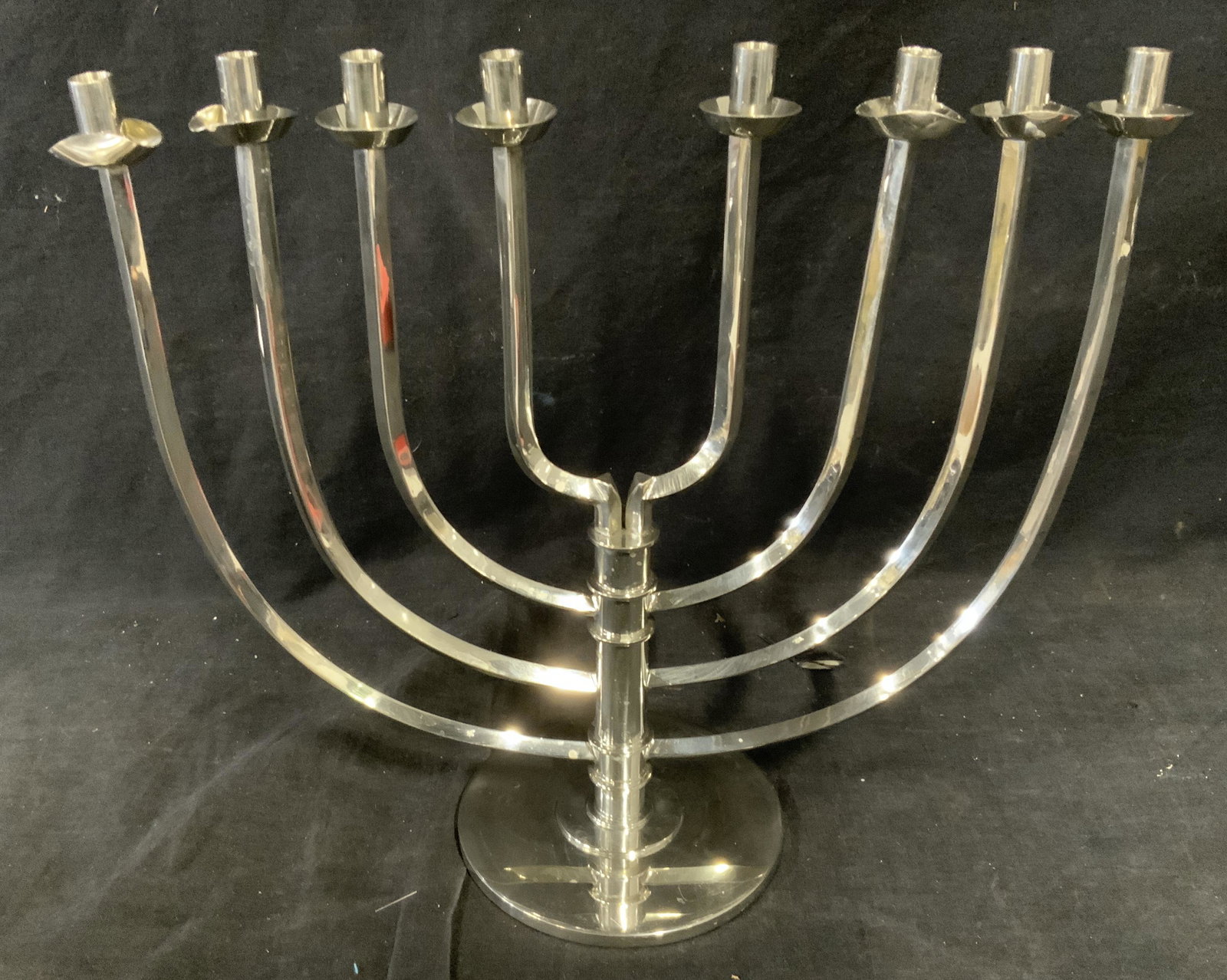 The Jewish Museum Pewter Ltd Ed Menorah: The Jewish museum pewter limited edition menorah, text to underside reads ‘The Jewish Museum 0828/1000’, some bends to ends of candlestick holders, surface wear to piece, measures 12 inches tall b
