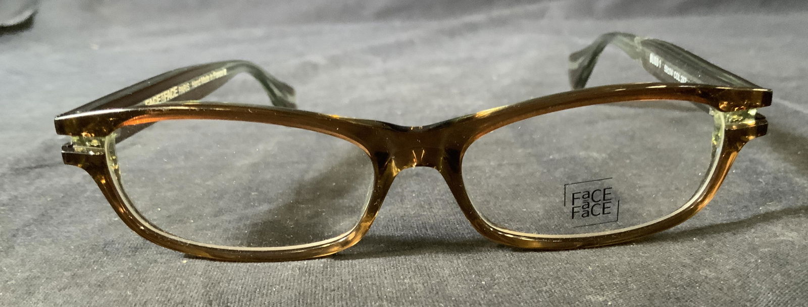 FACE A FACE Paris Glasses: FACE A FACE Paris Glasses, inscriptions read ‘Face a Face Paris Hand made in France Bliss 1 50 14 Col 287’ measures 5 inches wide, arms measure 5 3/8 inches long, surface wear to piece, Face a fac