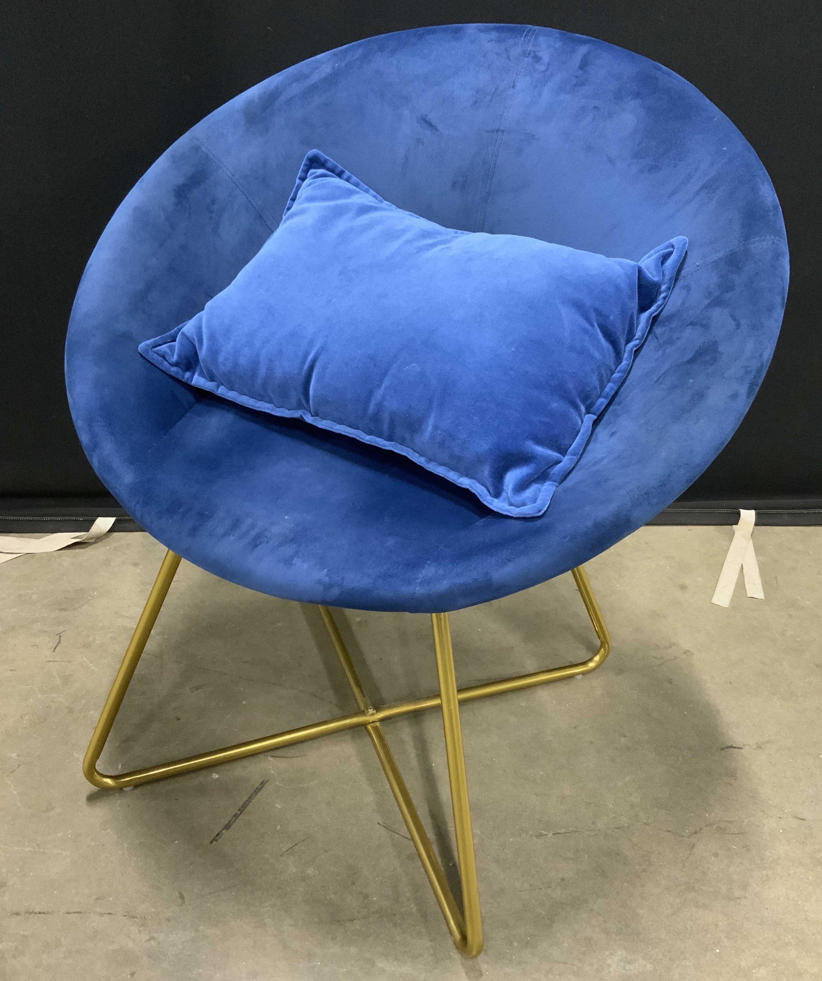 Bowl Chair w Throw Pillow: Bowl chair with throw pillow. Cobalt blue upholstery, metal frame, appears to be brass. Bowl shaped seating. Measures approx 31 inches H and 28 inches W. Wear is consistent with use. Side chair, bowl 