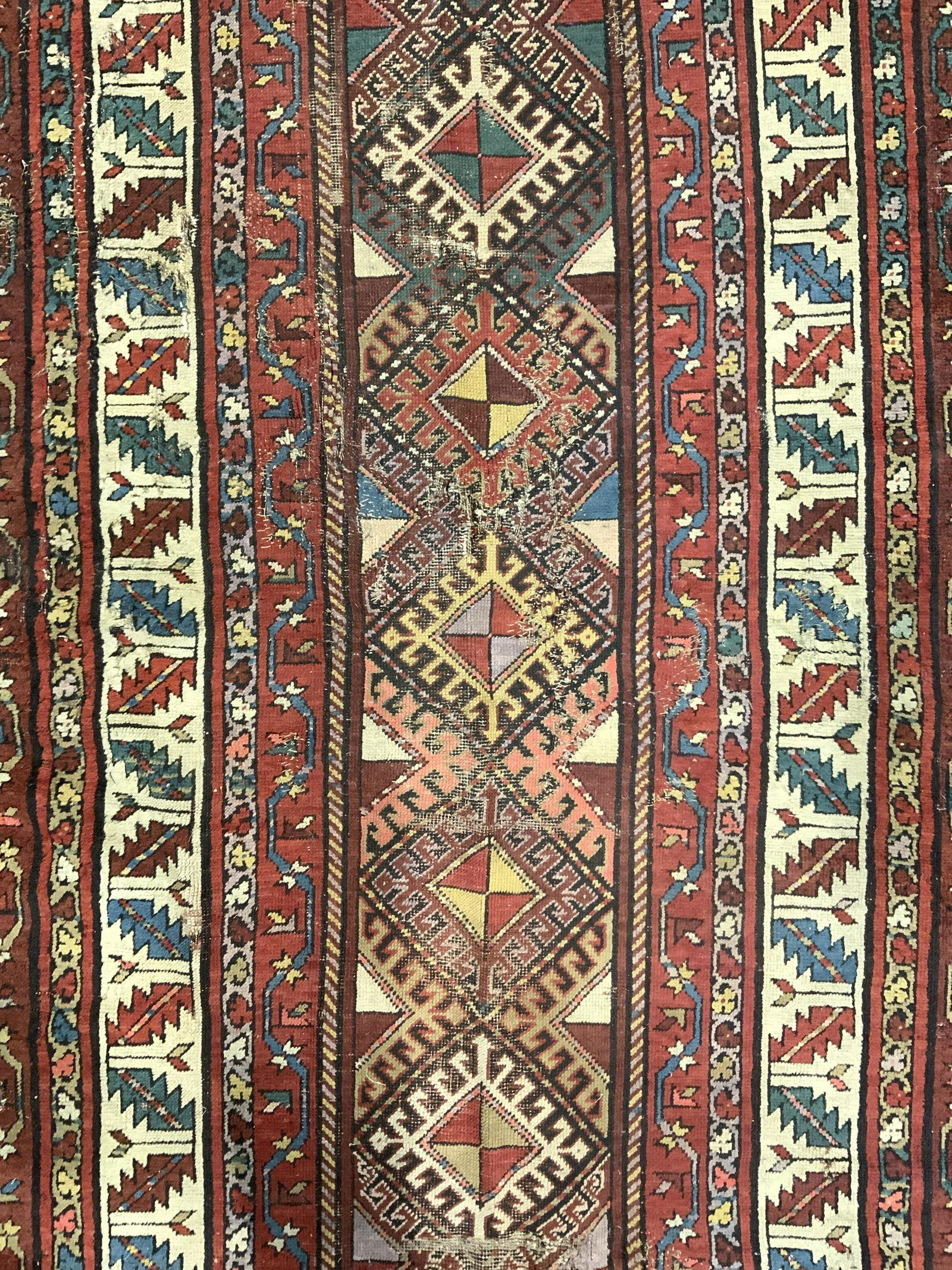 Antique Handmade Persian Wool Rug: Rug is wool and handmade. Piece appears to be handmade. Rug contains intricate multi toned geometric pattern detail. Piece measures approx 95 inches long 44 inches wide. Rug, carpet, vintage rug, anti
