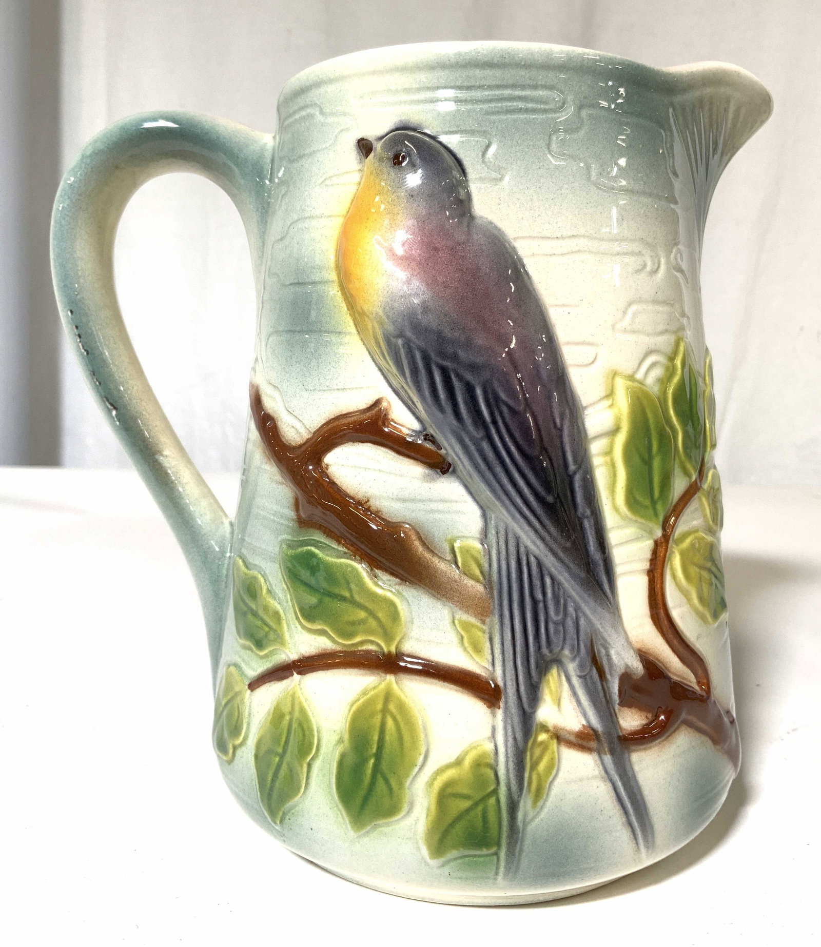 S CLEMENT French Porcelain Pitcher: Underside of piece is marked S CLEMENT FRANCE 7470. Piece has painted multi toned branch, leaf and beveled bird detail. Pitcher is porcelain. Appears to have been spray painted. Measures approx 7 inch