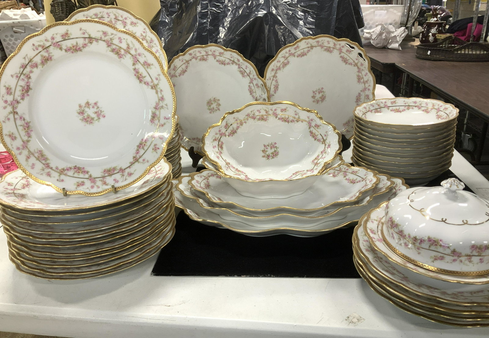 M&Z Austria Chinaware Set 51, Limoges France 8: Vintage M&Z White ware Fine bone Bavarian China dinnerware set, patterned with pink rosebuds, wide gilt rims and scalloped edges. Plate set and serving set. Hallmarked M Z AUSTRIA in Green ink under g