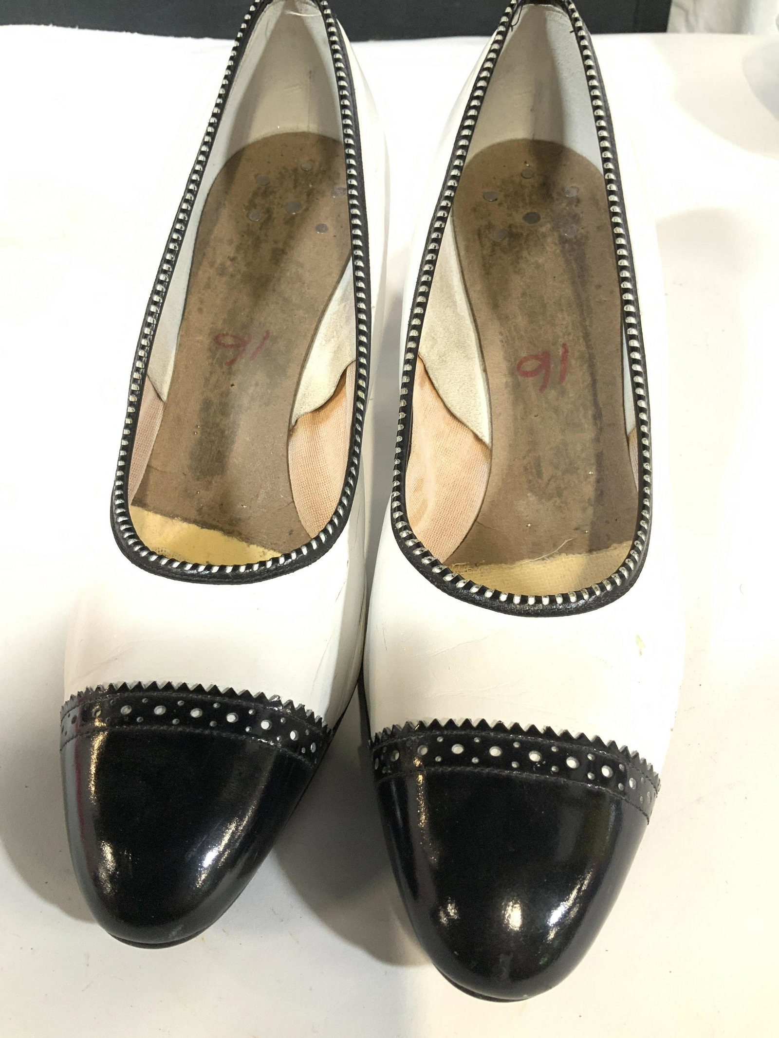 2 Pair Vintage Ralph Lauren Leather Shoes: White leather pumps with black patent leather tips , size 8.5 B, 2.5 in. Heels , interior needs new sole insets. exterior of shoe has some wear consistent with use and age. No marks. 2nd Pair Labeled 