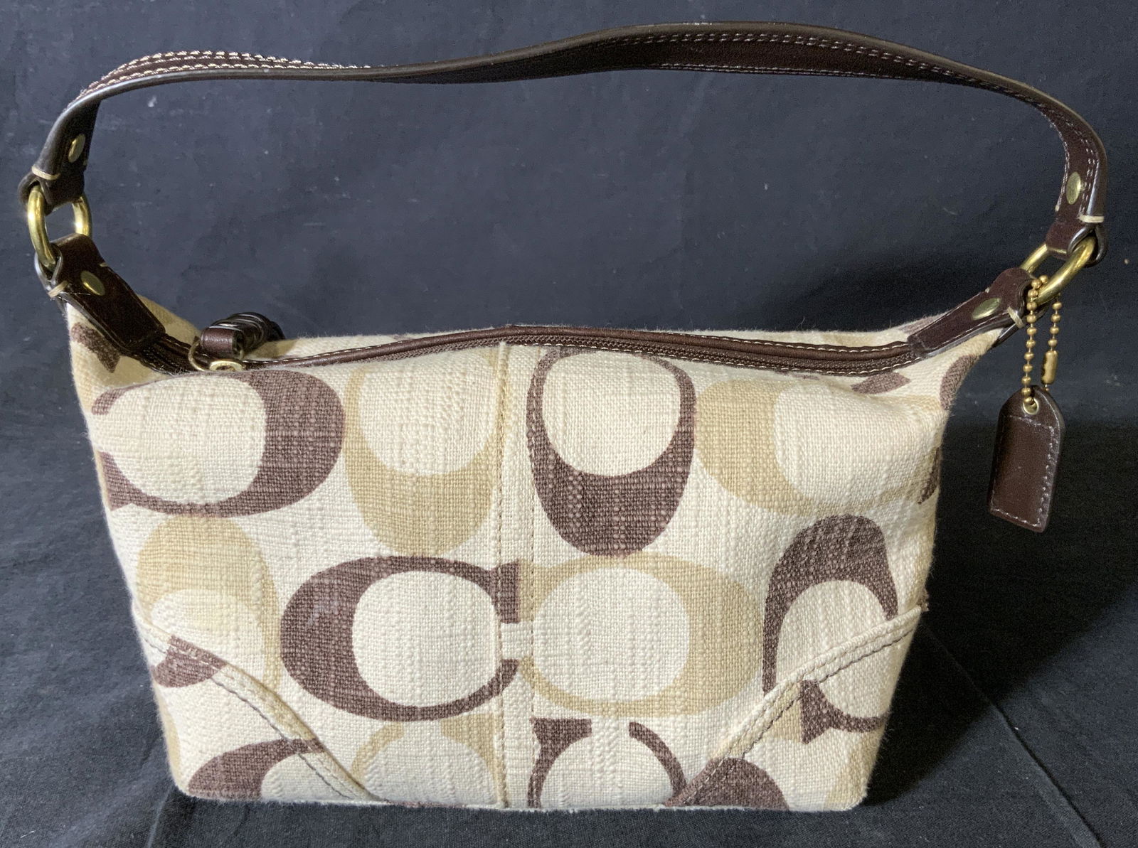 COACH Canvas Handbag Purse: COACH Canvas Handbag, label reads ‘Coach This is a Coach bag, it was handcrafted in China from the finest materials and leather’, measures 5 x 9 inches wide, drop measures 5 3/8 inches, wear evide