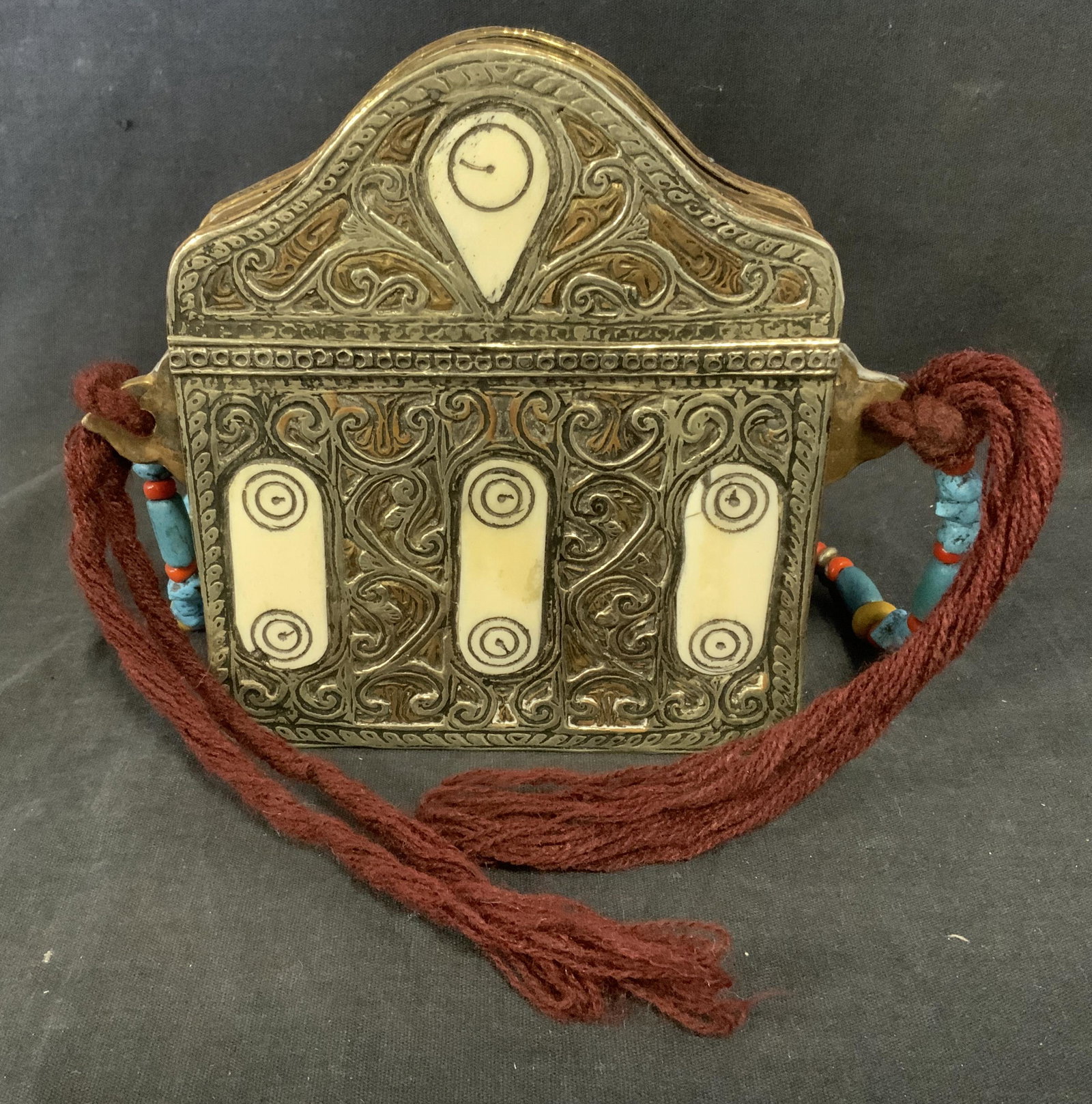 Vintage Metal Purse w Bone Inlay: Vintage, metal purse. Decorated with etched detailing and cut bone inlay. Strap is crafted from various stones, wool tassels hand from sides of the purse. Wear is consistent with age and use. Measures