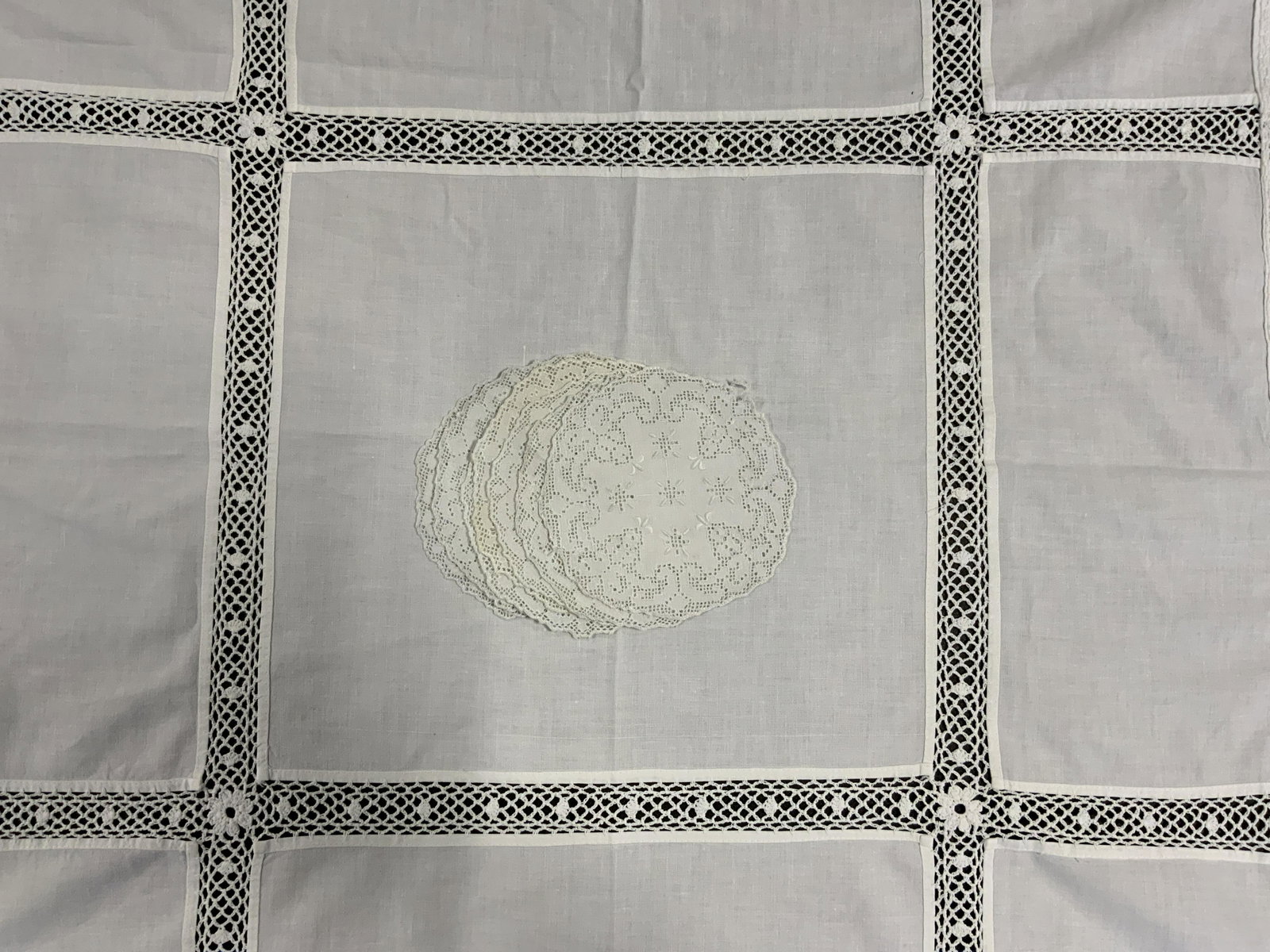 Lot 9 Vintage Doilies & Dresser Scarf: Lot 9 Vintage Doilies & Dresser Scarf, no apparent inscriptions or labels, doilies all measure approximately 5 1/8 inches in diameter, dresser scarf measures 34 1/8 x 34 1/4 inches, stains and holes t