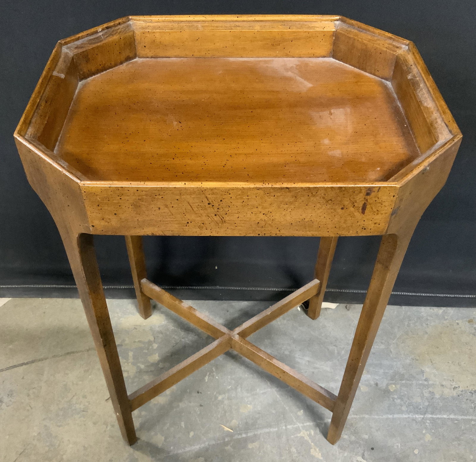 BRANDT Vintage Wood Veneer Side Table: Underside of table has tag which reads BRANDT. Piece is brown toned & appears to be veneer. Tabletop has octagonal shape. Legs have x shaped stretcher in between. Piece measures approx 21 inches tall 