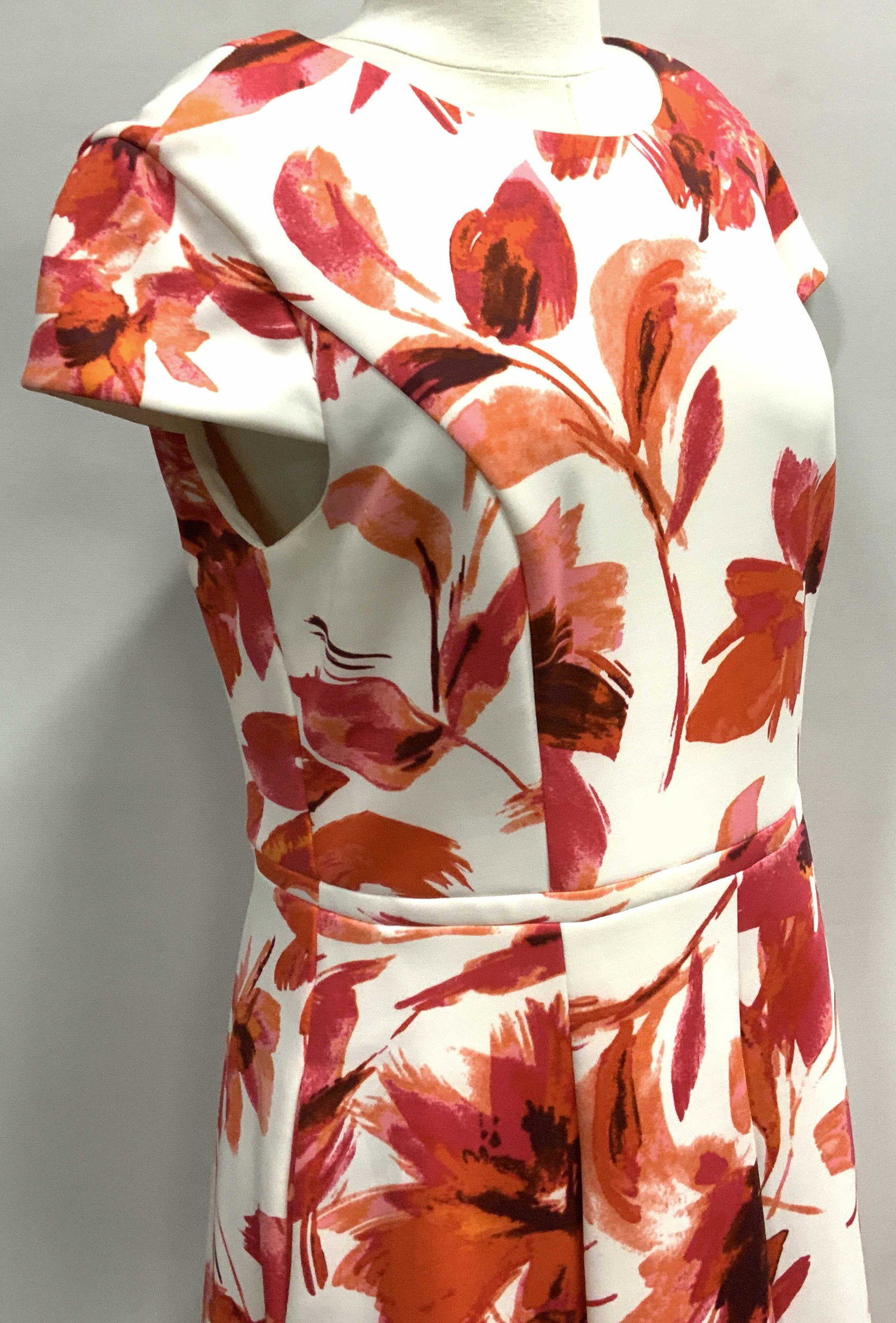 Vince CAMUTO Floral Short Sleeve Cocktail Dress: Size 12. Colorful Designer Dress, white with Fuchsia & orange florals . High collar neck, capped sleeves, 37in. Long. Designer label attached. Possibly rayon or acetate fabric, not labeled.. A nice pi