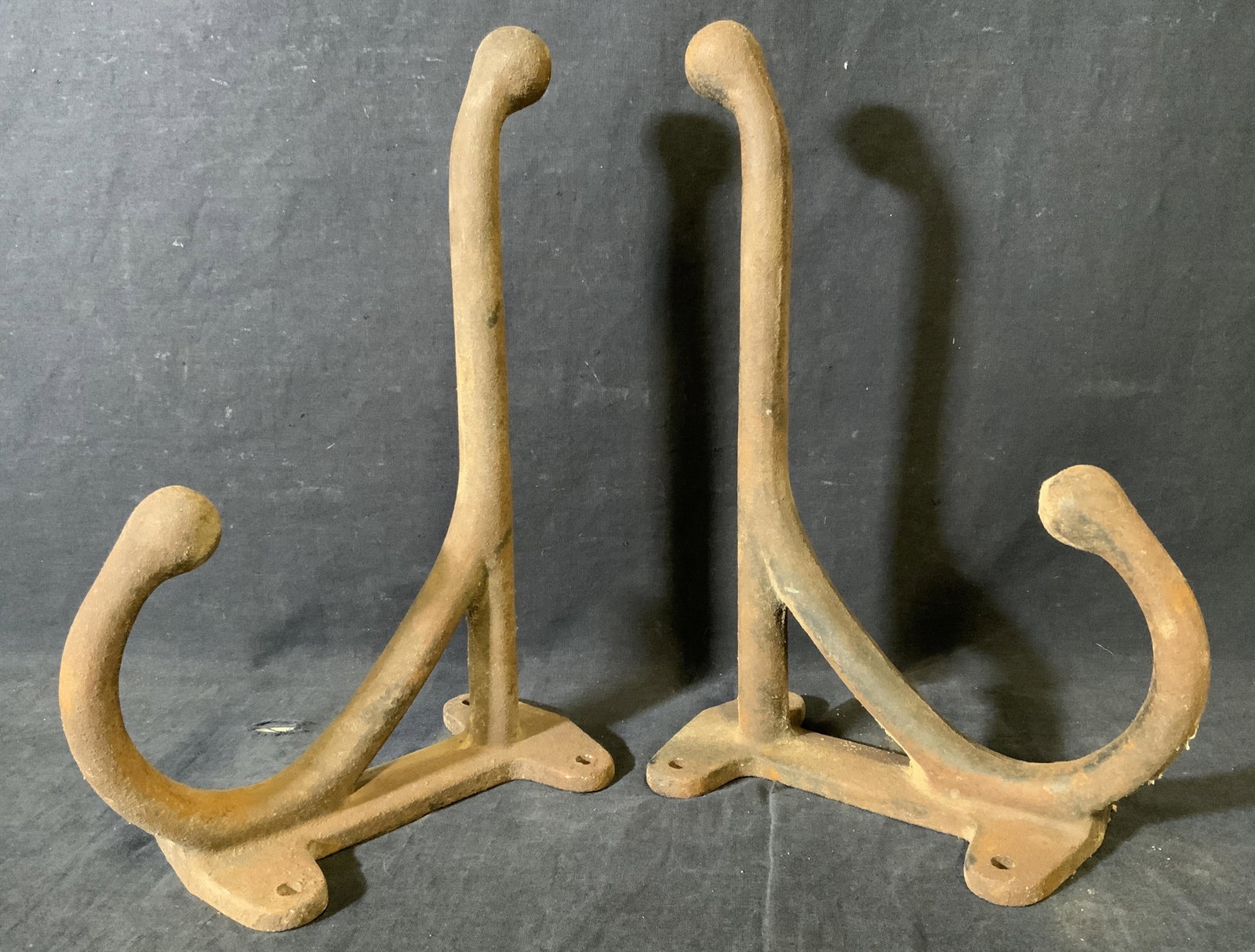 Pair Antique Iron Saddle Hooks: Antique iron saddle hooks. Wear is consistent with age and exposure. Each measures approx 12.75 inches L and 8.25 inches H. Property of Redding, Connecticut horse farm. Riding memorabilia, equestrian,