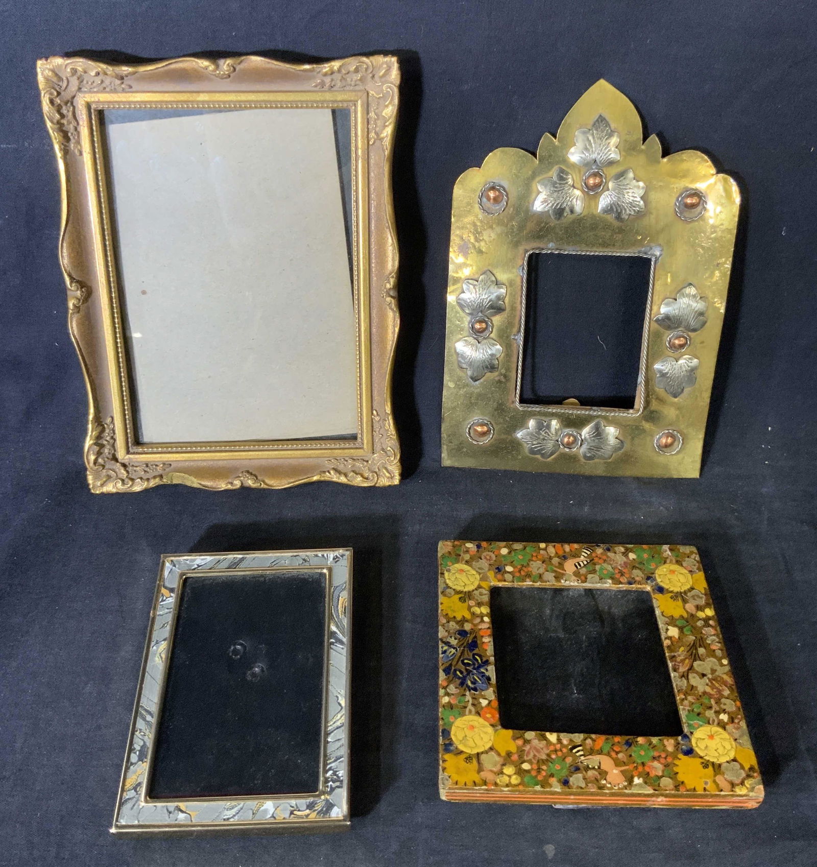 Lot 4 Metal & Wood Picture Frames: Lot 4 Metal & Wood Picture Frames, inscriptions read ‘Elite Birmingham England’, ‘Hand painted Vishimir India’, ‘Burnes’, smallest frame measures 5 1/8 x 3 5/8 inches, largest measures 8 1
