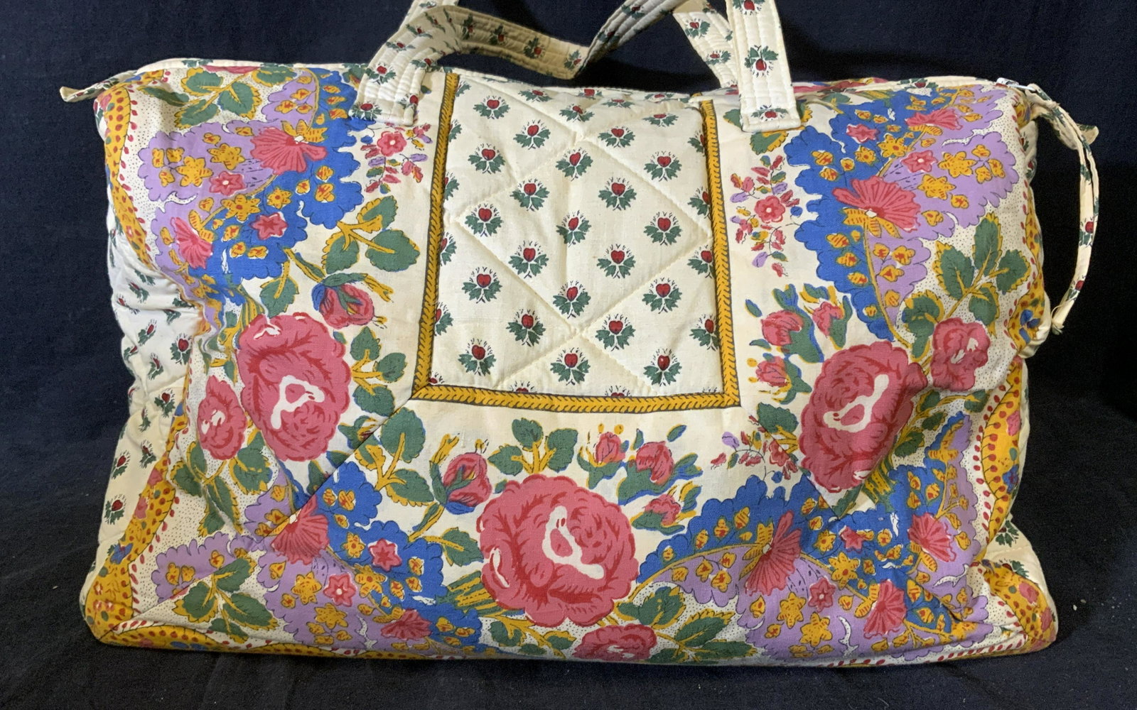 Vintage PIERRE DEUX Tennis Bag: PIERRE DEUX tennis bag. Pocket for racket on exterior, two handles, decorated with floral patterns, quilted surface. Measures approx 20.5 inches H and 20 inches W. Wear is consistent with age and use.