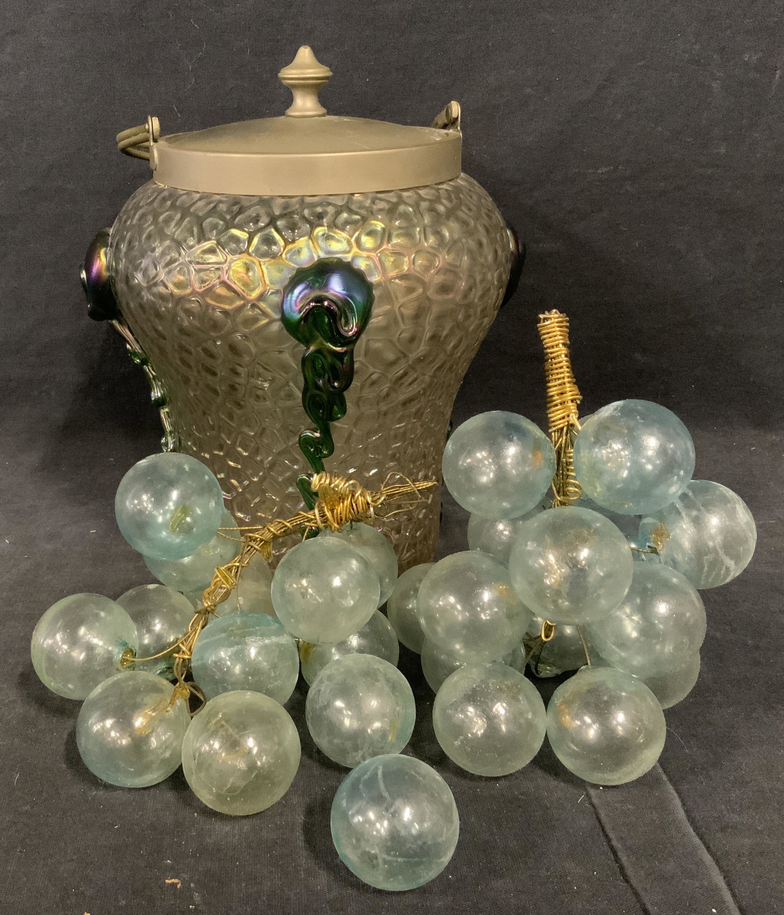 Glass Lidded Container & Art Glass Grapes: Glass lidded contained and art glass grapes, grapes are made of light blue art glass with gold toned coils, two of the grapes have fallen off the steams, pearlescent cool toned art glass lidded contai