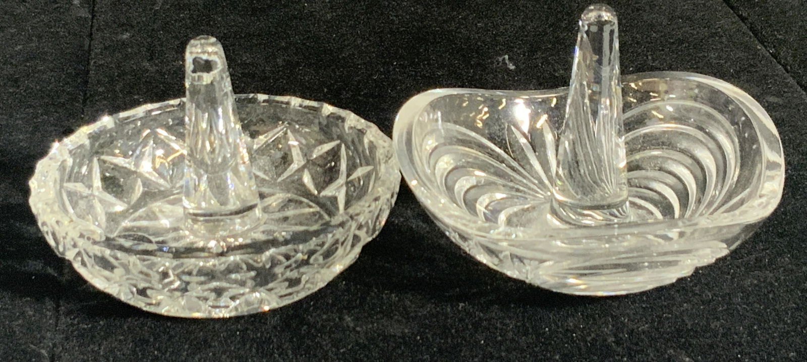 Lot 2 Handcrafted Clear Glass Ring Holders: Two handcrafted cut glass ring holders / dishes. Each piece features a raised center for placing rings and other jewelry items. One piece has a sticker that reads: Handcrafted, over 24% PBO, Made in J
