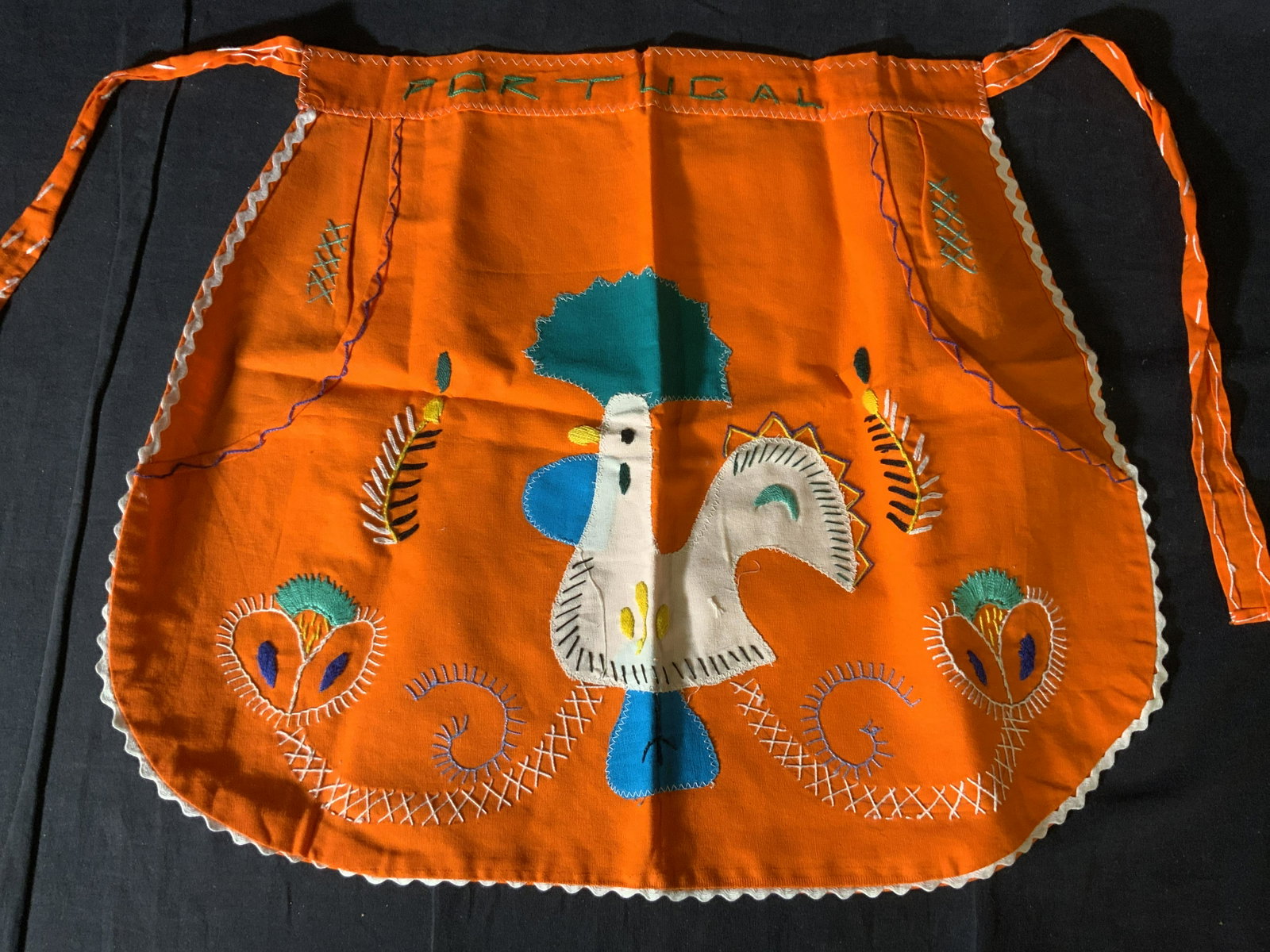 Lot 5 Napkins, Tea Towel, and Apron: Lot 5 Napkins, Tea Towel, and Apron, inscription to apron reads ‘Portugal’, measures 17 x 20 3/4 inches, towel measures 28 1/4 x 15 7/8 inches, napkins measure 15 3/8 x 15 7/8 inches, stain and lo