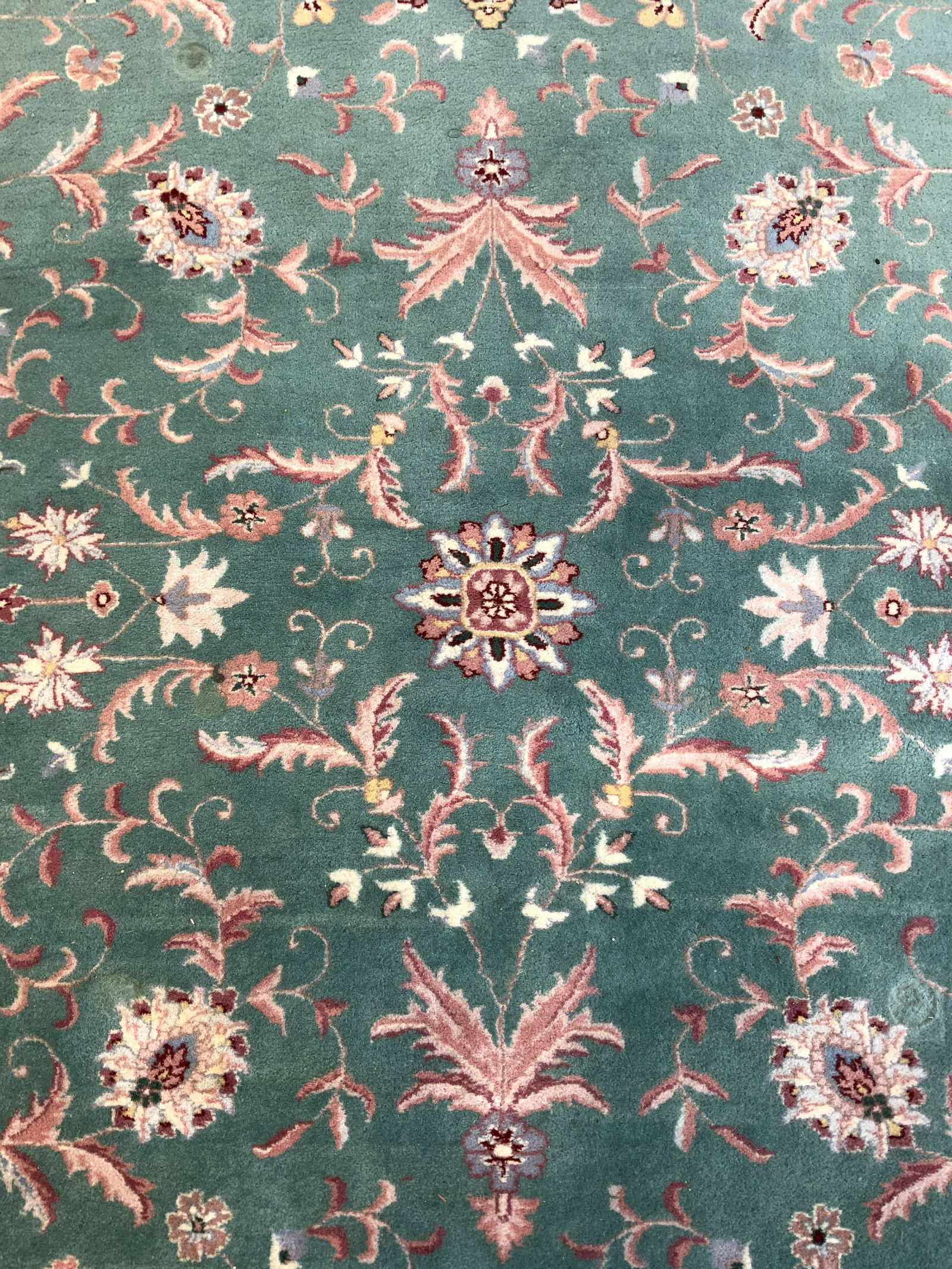Vintage Handmade Wool Pile Oriental Room Size Rug: Rug is wool pile & handmade. Piece has cream toned fringed at edges. Piece has intricate multi toned floral vine & leaf motif detail. Piece measures approx 141 inches long 101 inches wide. Rug, carpet