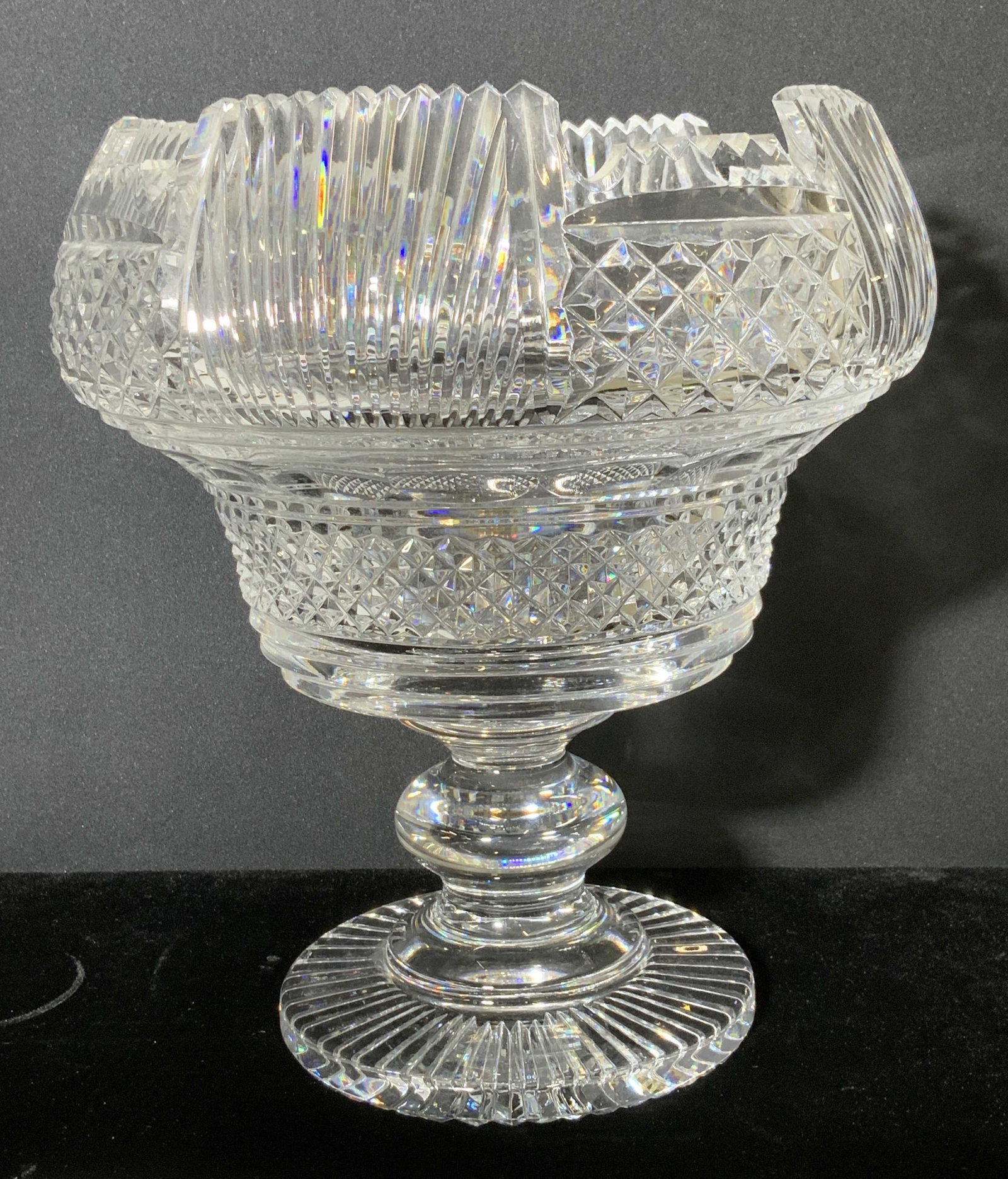 HAND CUT CRYSTAL PEDESTAL BOWL CENTERPIECE: Show stopping vintage hand cut crystal pedestal centerpiece/ fruit bowl/ punch bowl/ decor with saw tooth rim and multiple patterns throughout. Possibly circa early 1900s, possibly antique. Brilliant 