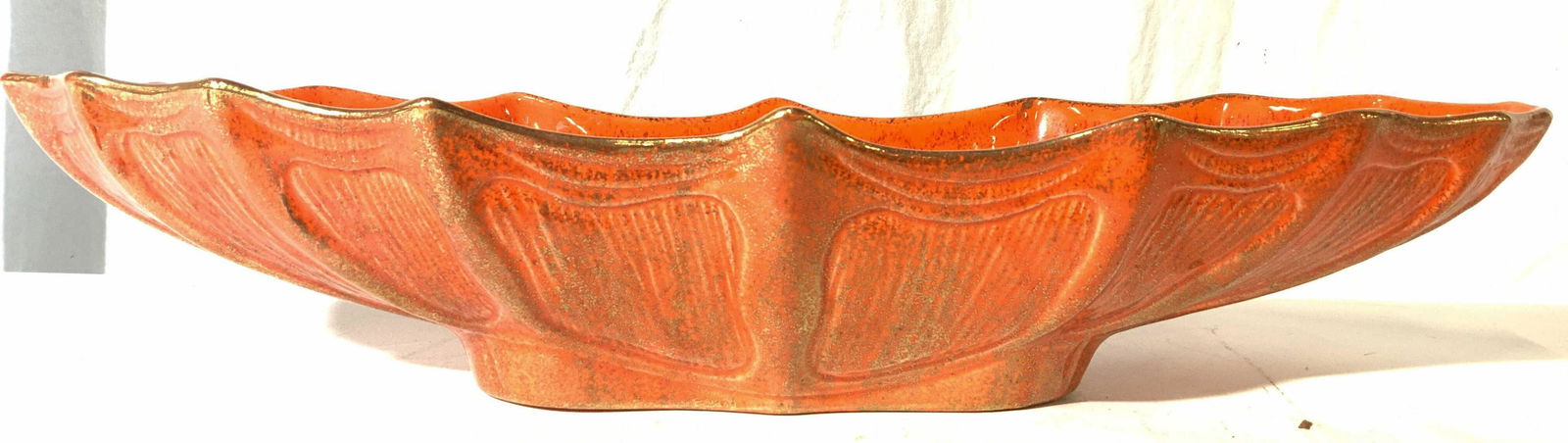 California Pottery Vintage MCM Orange Swirl Glazed: USA California Pottery Vintage MCM Orange Swirl Glazed. Underside is marked CAL ORIG. Piece is orange toned with gold gilt detail. Piece measures approx 21.5 inches long 6.5 inches deep 4 inches tall.