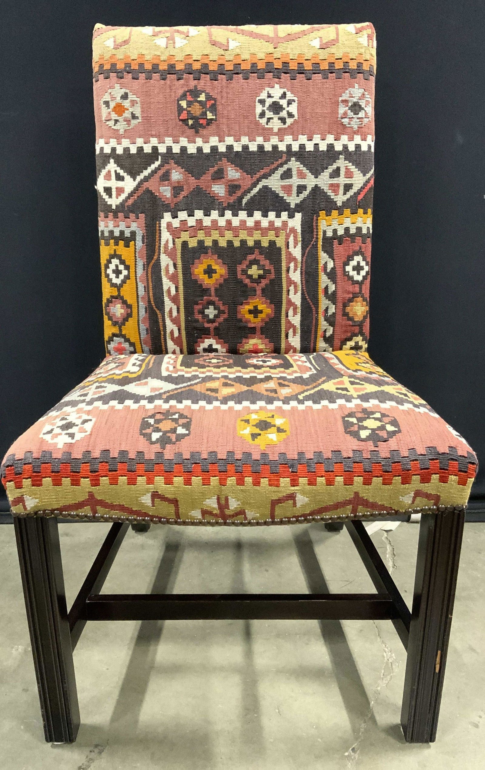 Vintage GEORGE SMITH LTD Upholstered Chair: Underside has tag which reads GEORGE SMITH LTD. Piece appears tto possibly be upholstered with Kilim carpet. Upholstery has multi toned geometric detail. Edges of upholstery have bronze toned nailhead