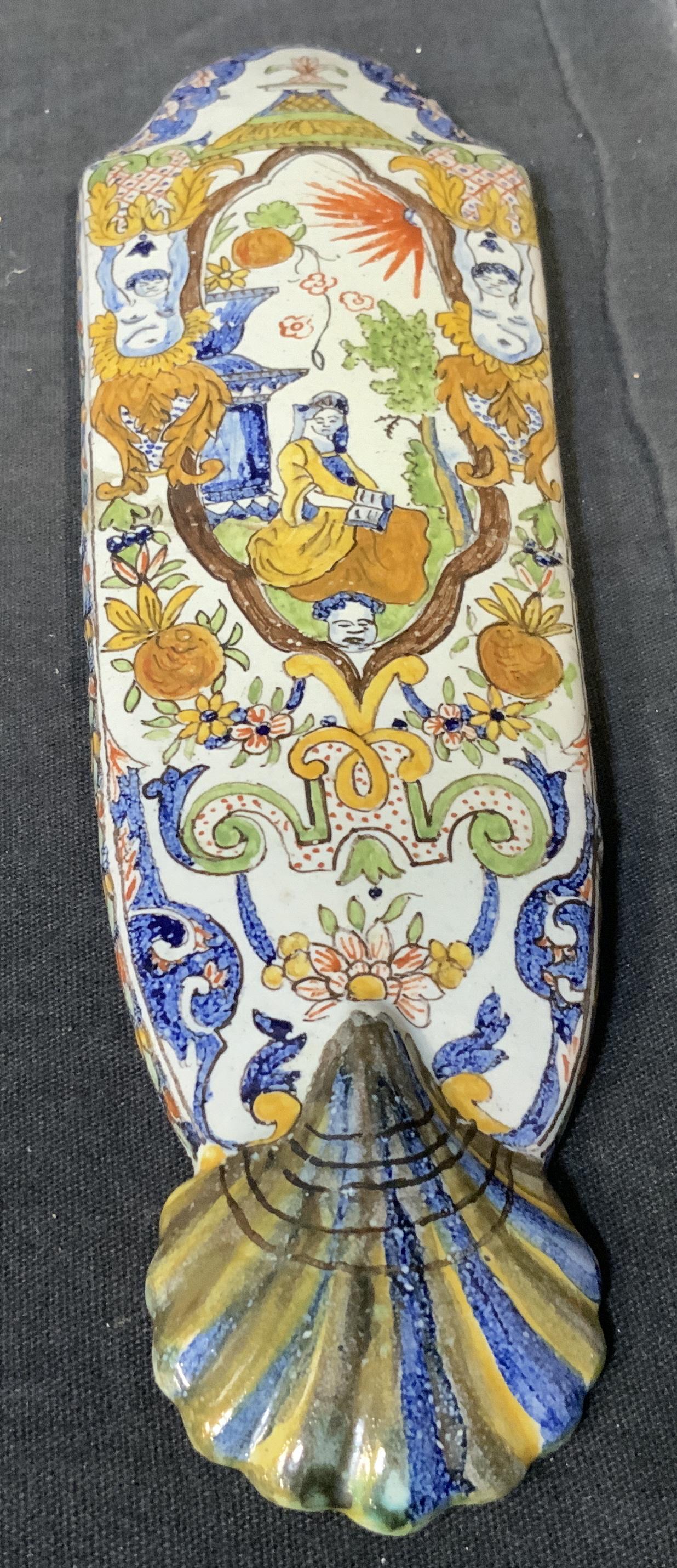 Hand Painted Asian Porcelain Wall Ornament: Hand painted Asian porcelain wall ornament, appears to be porcelain possibly earthenware, initials to reverse read ‘AR’, subject an oval shaped piece of porcelain with a pictorial scene painted to