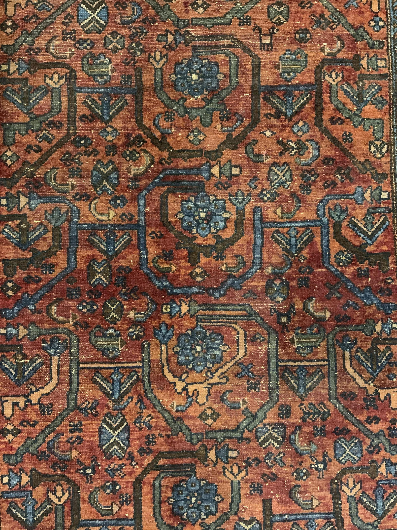 Vintage Handmade Persian Wool Area Rug: Rug is vintage possibly antique. Piece appears to be Persian. Rug has intricate multi toned floral, leaf, & geometric detail. Piece has very short fringes at edges. Piece measures approx 76 inches lon