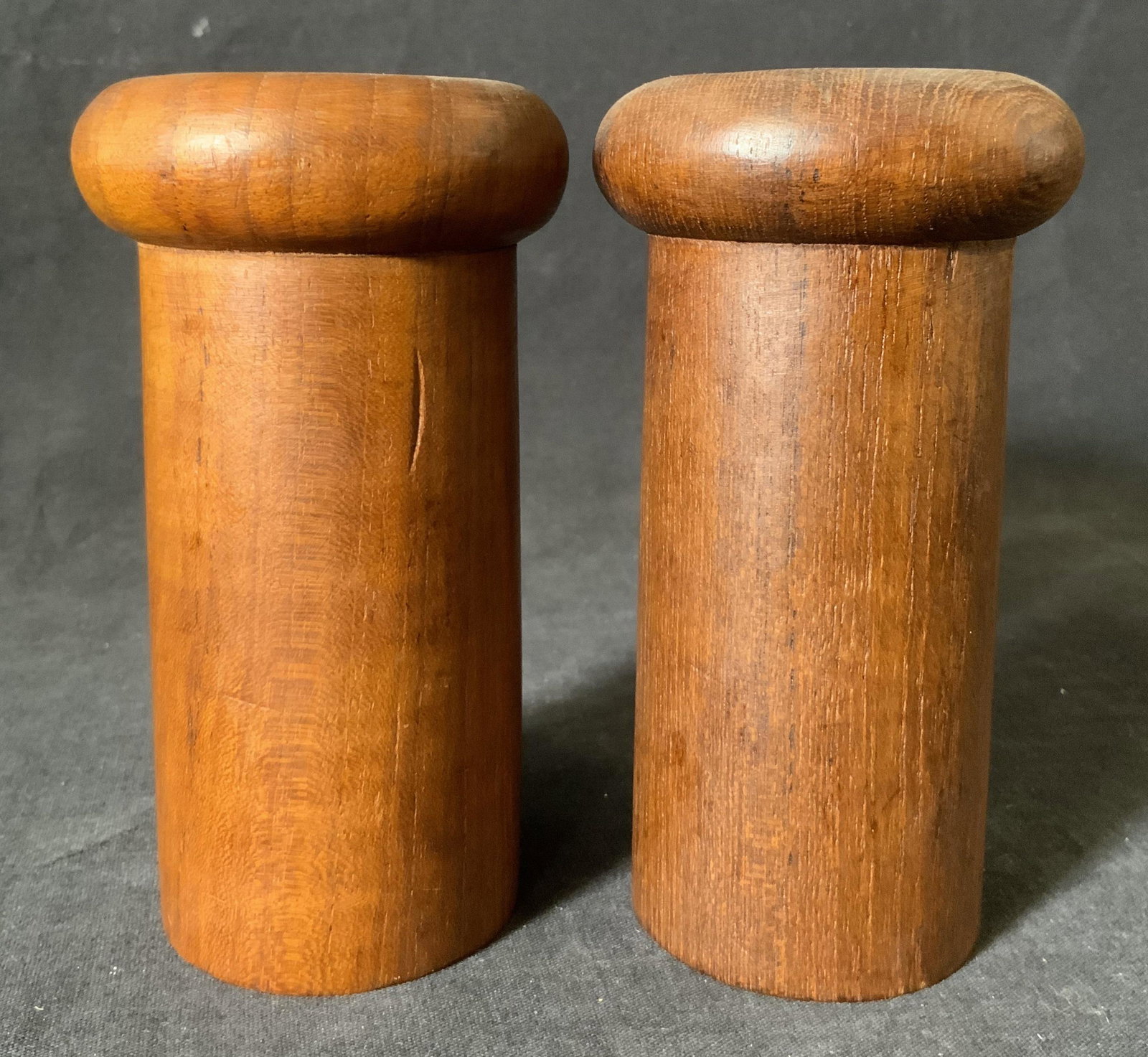 Pair KNOBLER MCM Teakwood Salt & Pepper Shakers: Pair KNOBLER MCM Teakwood Salt & Pepper Shakers, label reads ‘Knoblee Thailand Genuine Teak’, both measure 5 1/4 inches tall x 2 7/8 inches in diameter, surface wear to pieces, KNOBLER, teakwood, 