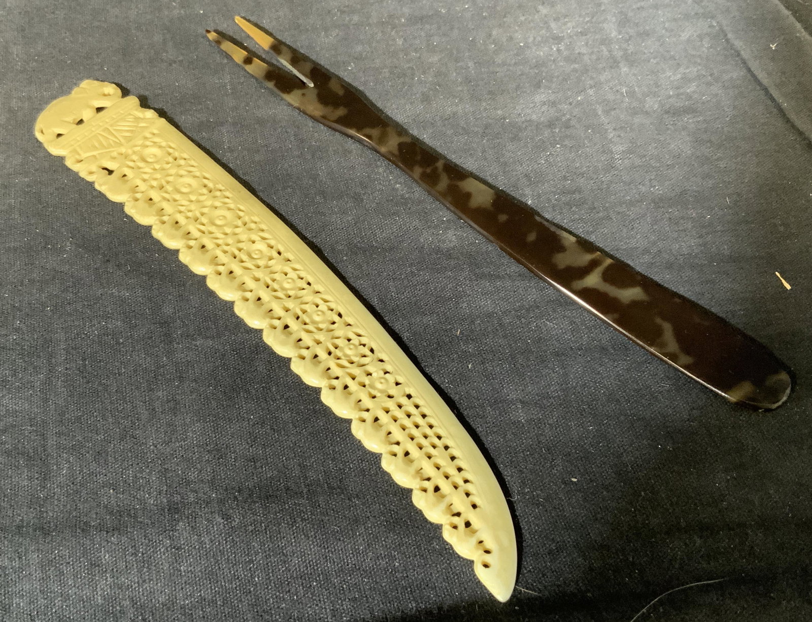 Two Composite Utensils: Two composite utensils, group lot a shell colored prong and a bone colored object, object possibly a letter opener, both measure approximately 7 inches long, surface wear to pieces, Group lot, composi