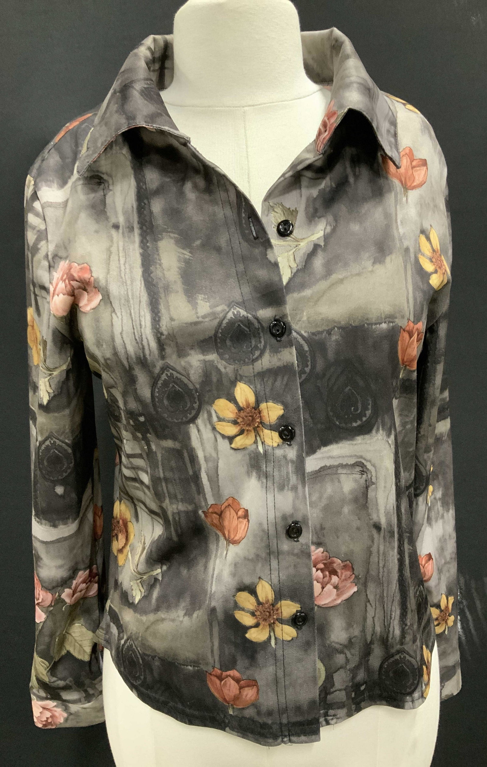 ANXIETY Collectible Ladies Long Sleeve Shirt: size Med. Long Sleeve Polyester shirt. Variations of grey with yellow sunflowers and pink roses. Button down front. Anxiety is a brand you see all over Instagram. Each garment has a storyline. ANXIETY
