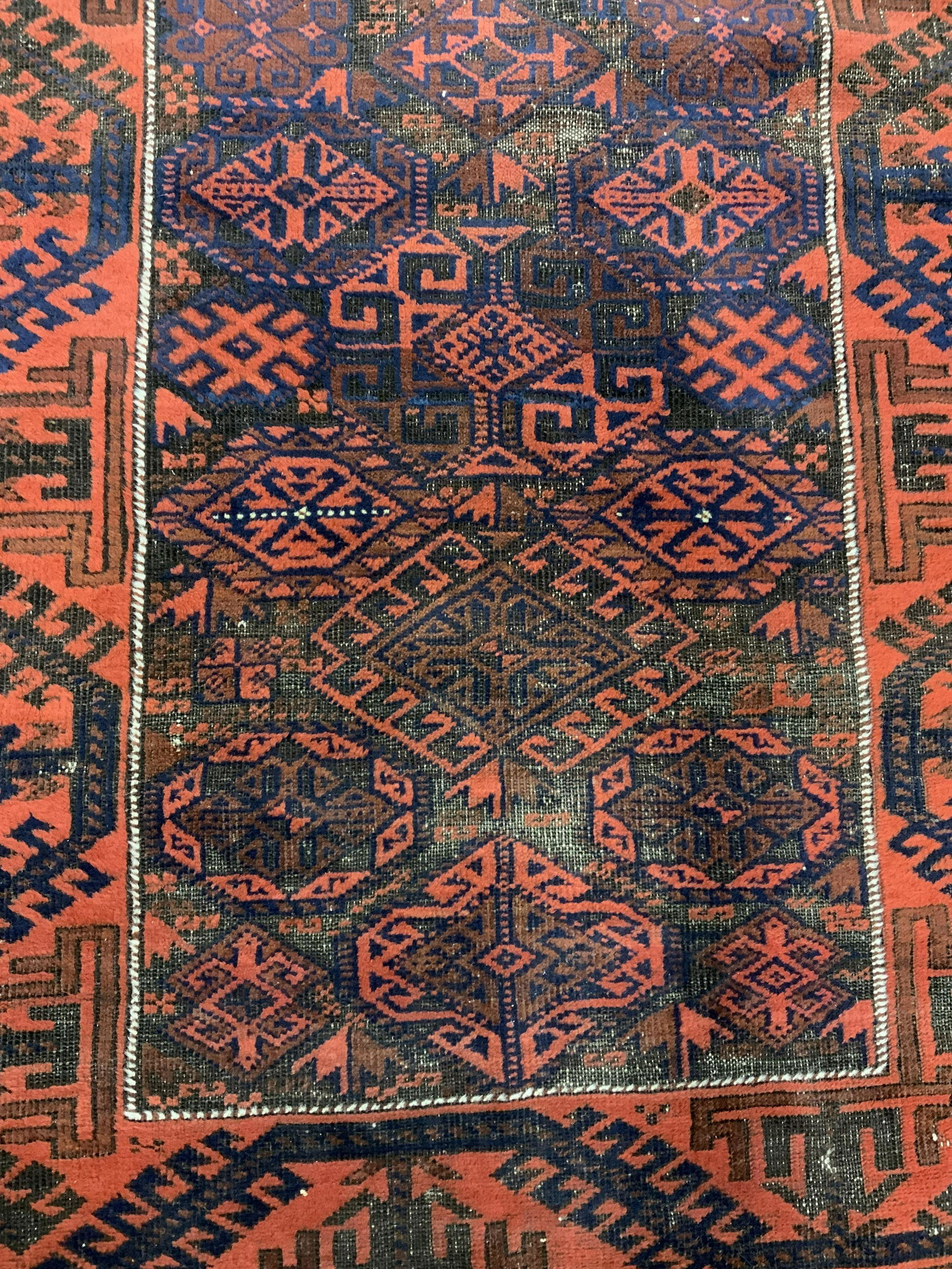 Vintage Persian Wool Rug: Vintage Persian rug. Possibly antique. Appears to be handmade. Wear is consistent with age and use. Measures approx 67 inches long, 37 inches W. Vintage accessories, vintage furnishings, Persian rug,