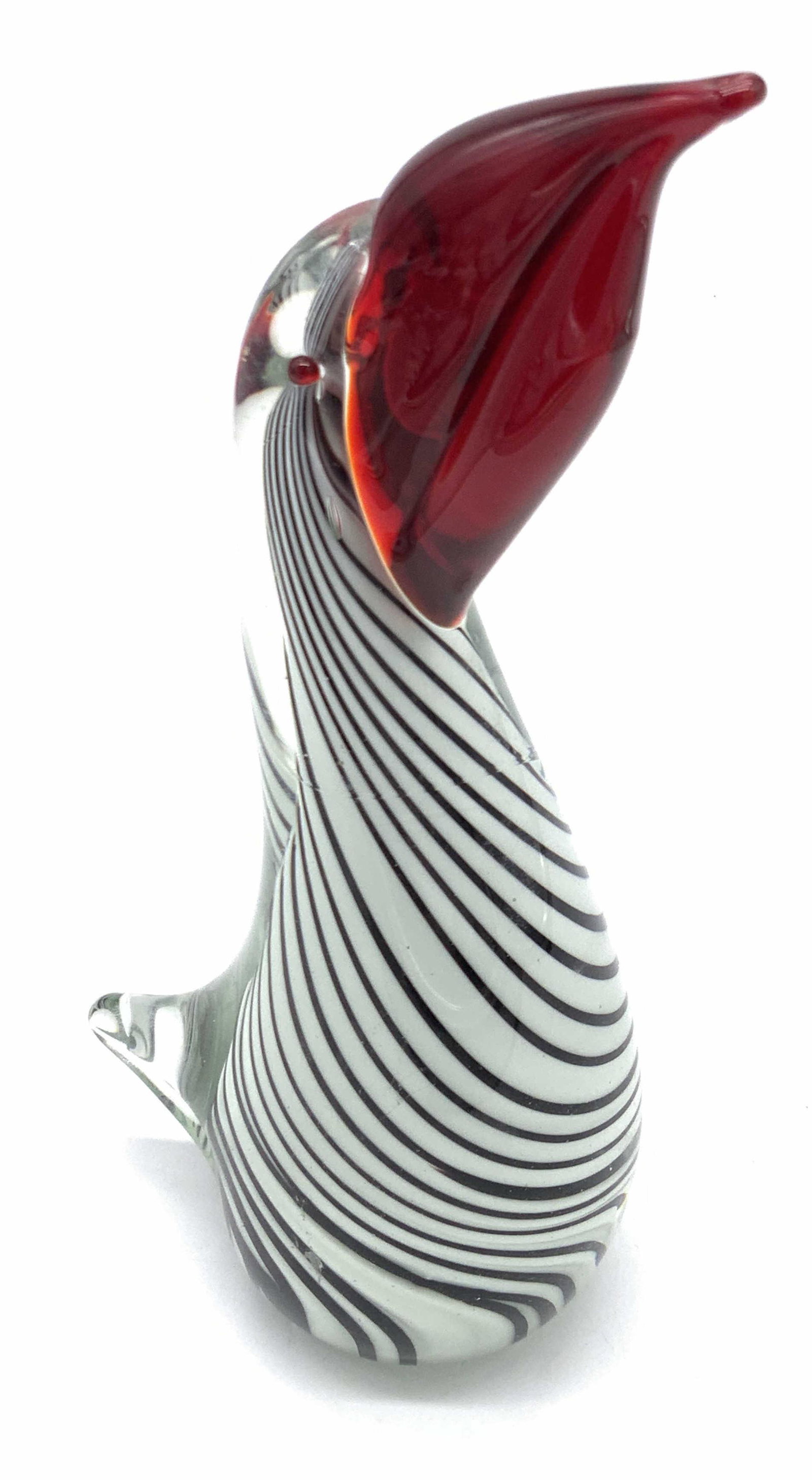 Hand Blown Art Glass Bird Figural, Collectibles: Hand blown art glass bird figural. Possibly depicting a pelican. The beak and eyes are a deer red, the body is swirled deep red, black, colorless, and white. The underside has sticker residue, beneath