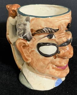 Vntg Hand Painted Ceramic Old Man Character Mug: Hand painted vintage Toby style character mug depicting the face of an old man wearing glasses. The handle is crafted into the form of a rabbit. Underside reads Made in Occupied Japan. Approx. 5H x 5W