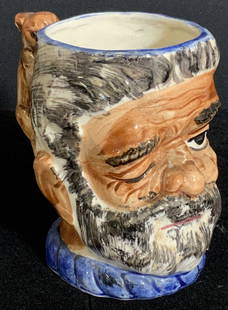 Vntg Trademark Hand Painted Ceramic Character Mug: A vintage hand painted character mug depicting the face of a bearded old man winking. The handle is crafted into the form of a rabbit. Underside reads Made in Occupied Japan. Underside is also tradema