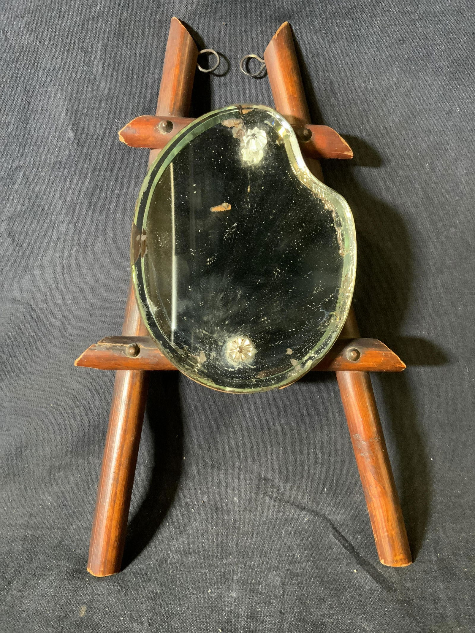 Easel Shaped tabletop Mirror: Easel Shaped Mirror, no apparent inscriptions or marks, measures 10 1/2 x 6 inches wide, surface wear to piece, losses to wood, Easel, mirror, art decor, decorative mirror, wall accessory, home decor.