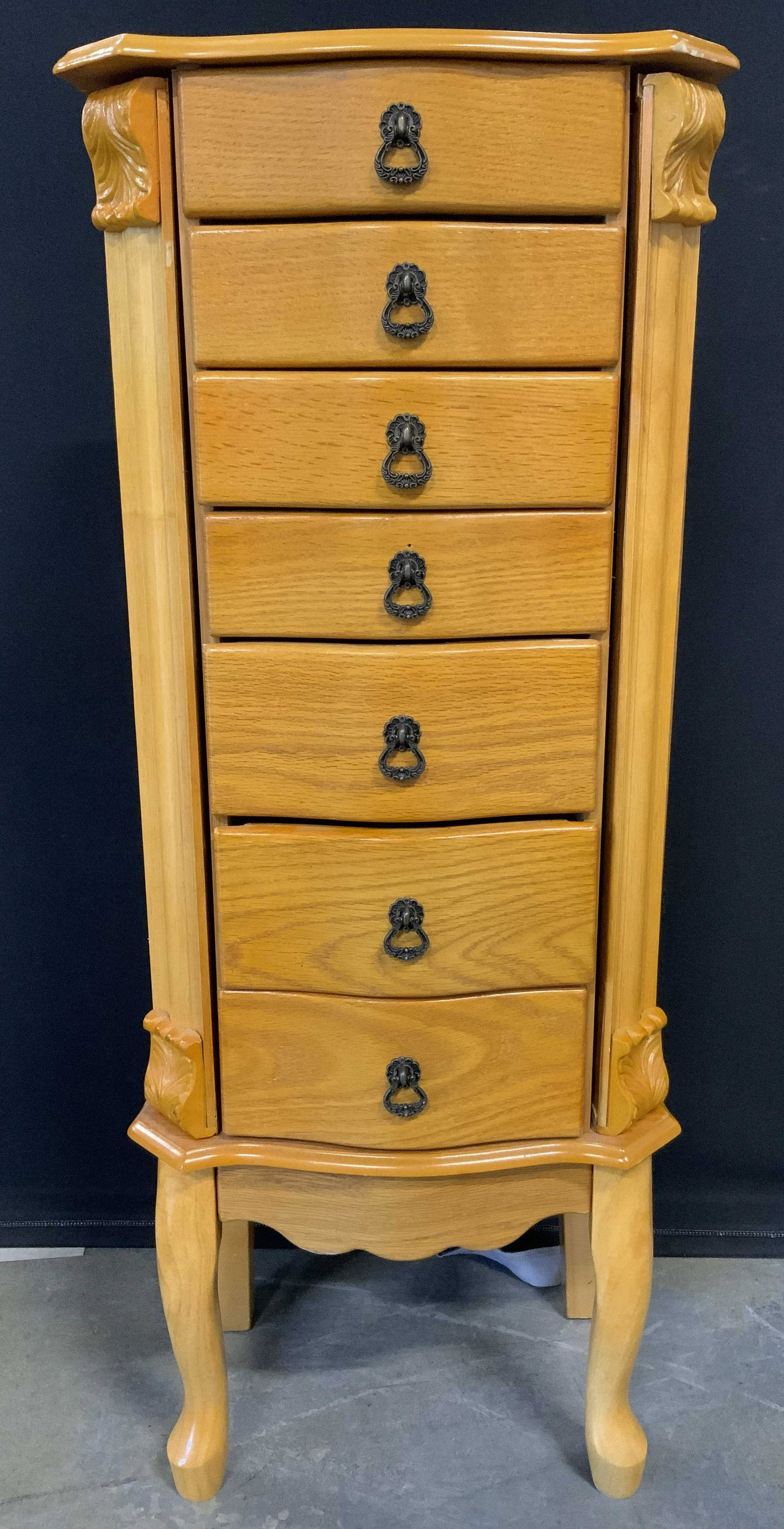 POWELL INC 6 Drawer Jewelry Chest: Jewelry Chest has tag on backside which reads POWELL INC. chest has 6 drawers each with dangling metal handles. Top of chest has hinged lid. Front 2 feet are cabriole style. Piece measures approx 40 i